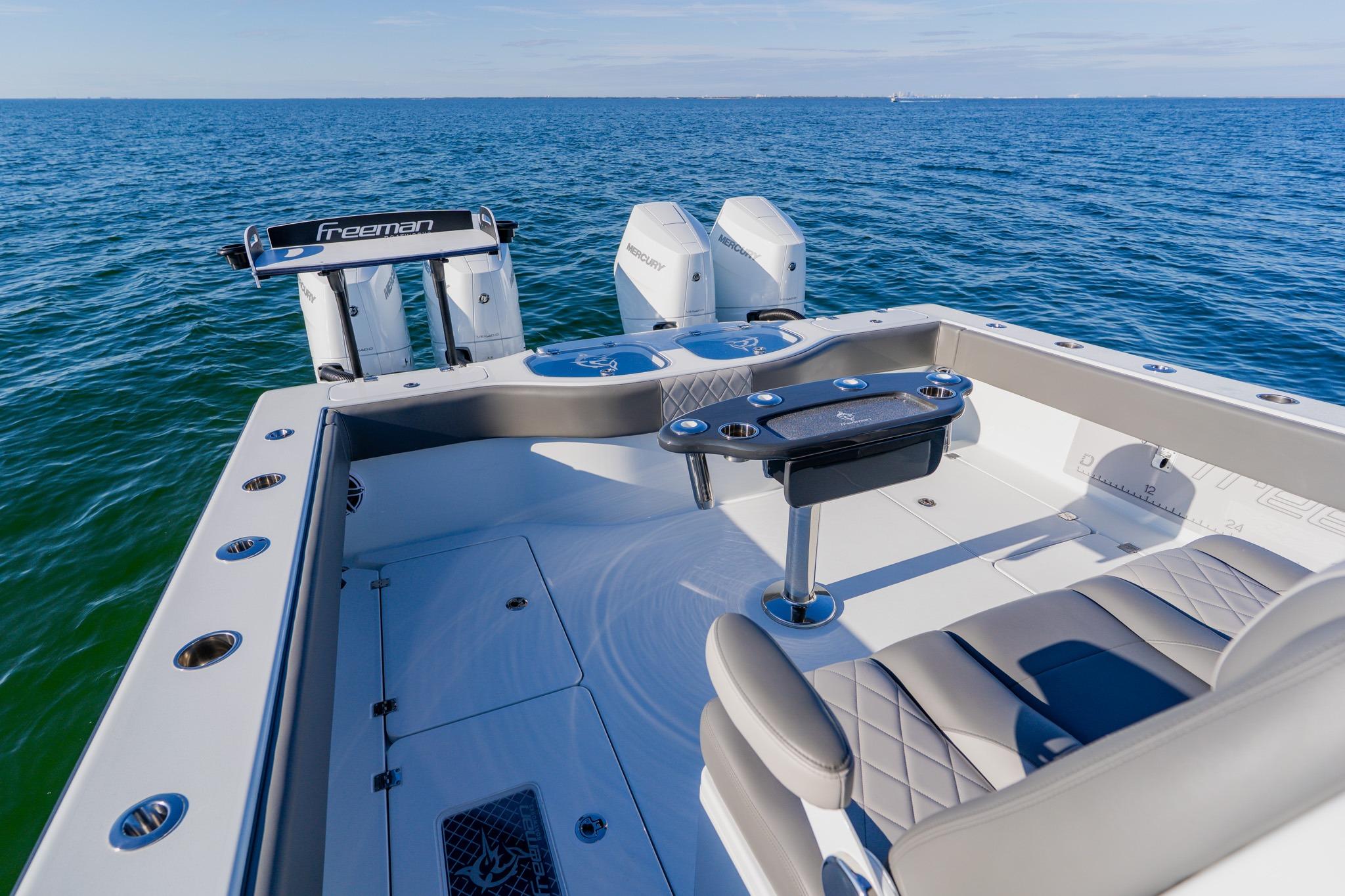 2025 Freeman 42LR boat with dual Mercury engines on open sea.