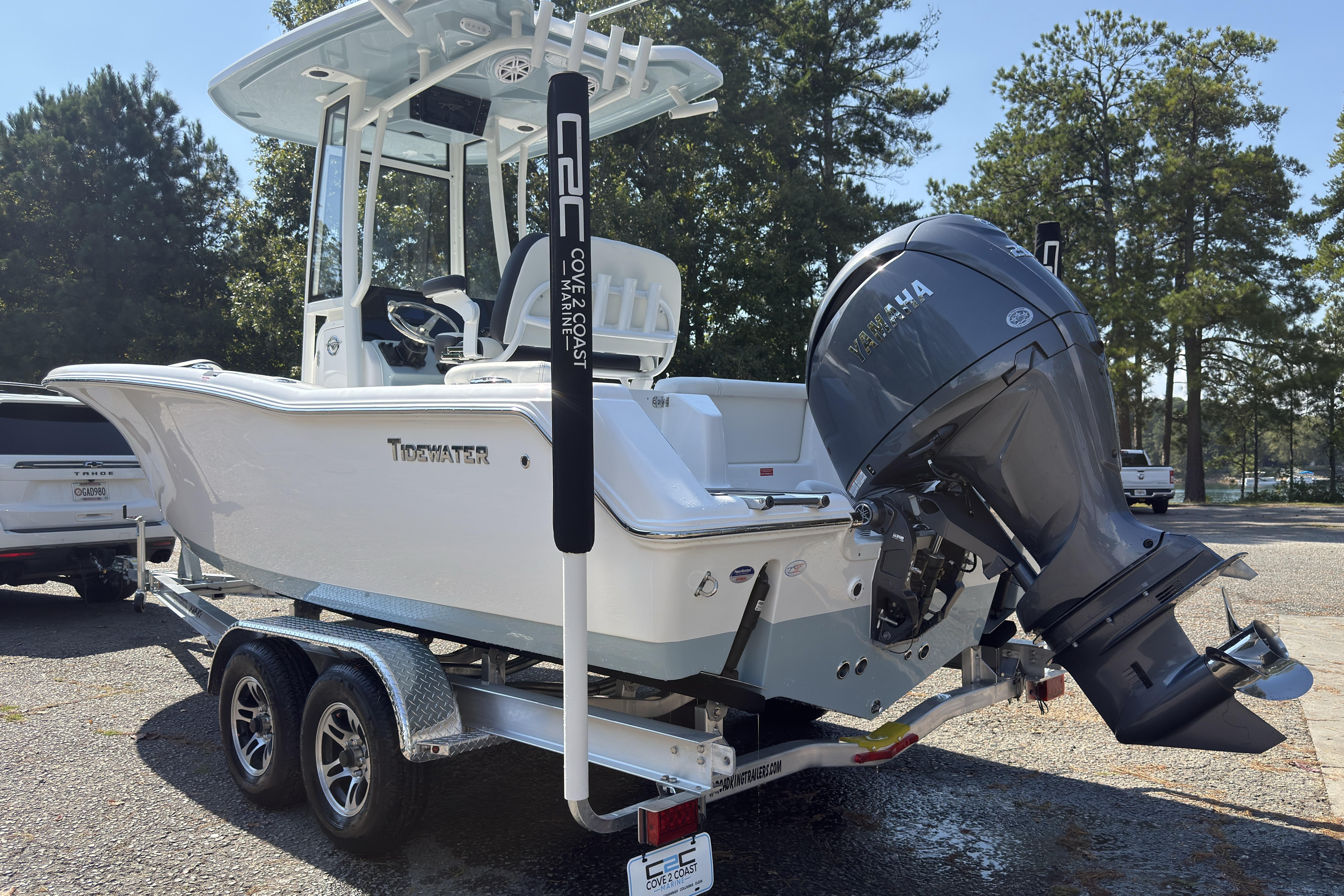 2026 Tidewater 220 LXF boat on trailer with Yamaha outboard motor, parked outdoors.