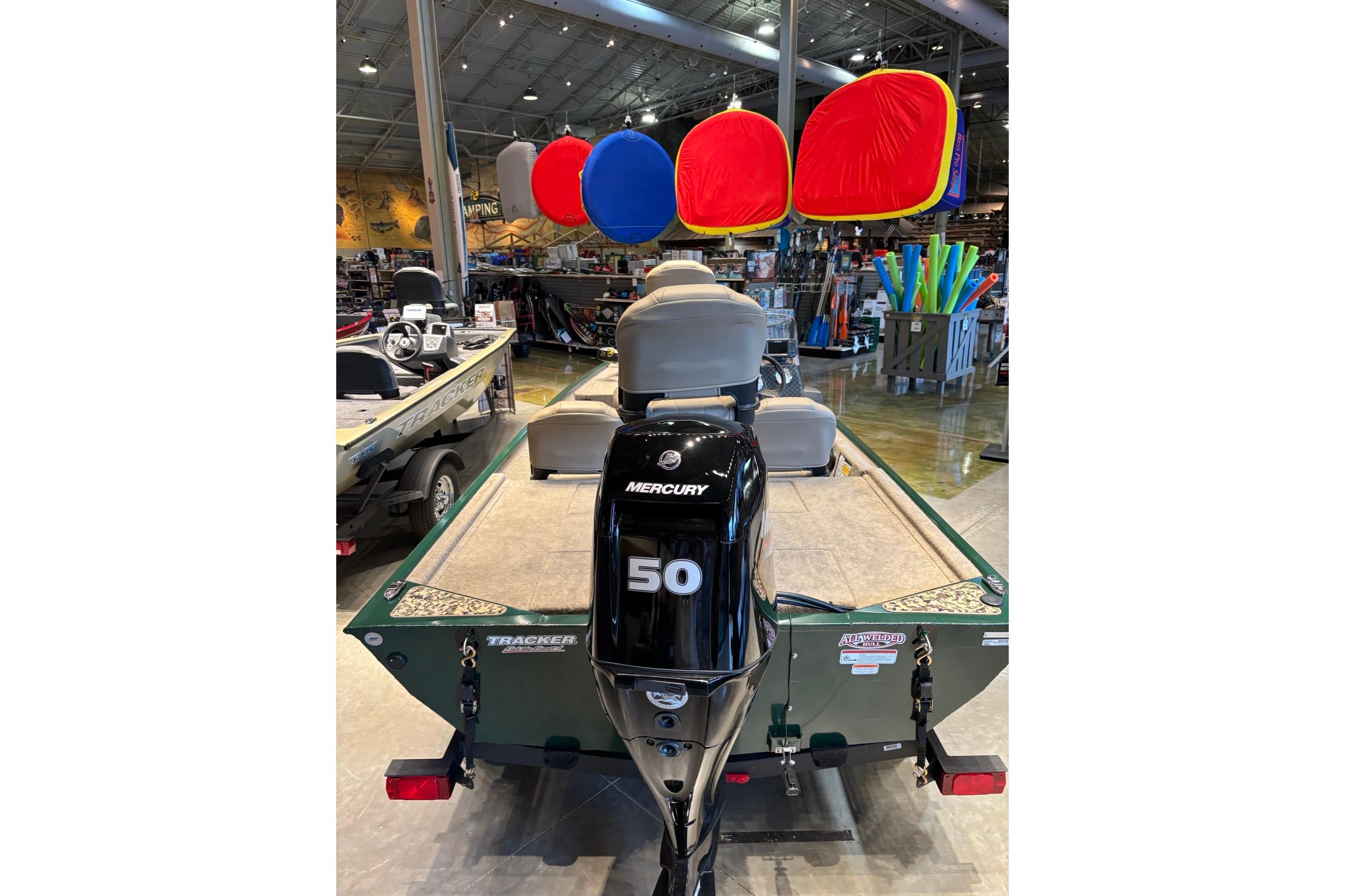 2026 Tracker Bass Tracker Classic Limited boat with Mercury 50 engine in showroom.
