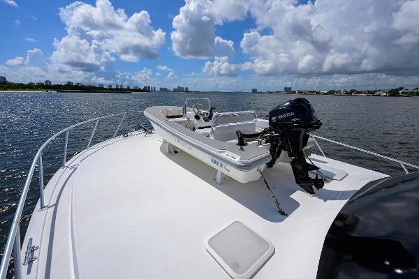 2000 Viking 50 Convertible yacht on open water under a bright blue sky.
