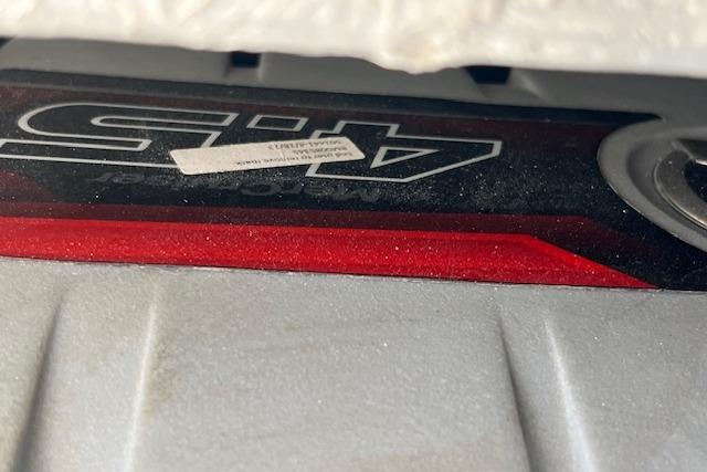 Close-up of a 2024 Bracewell 25 engine component with red and silver detailing.