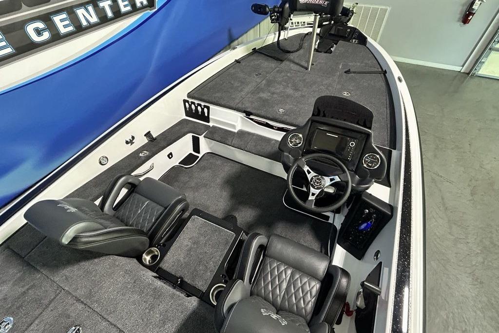2026 Phoenix 818 Pro boat interior with steering console and seating.
