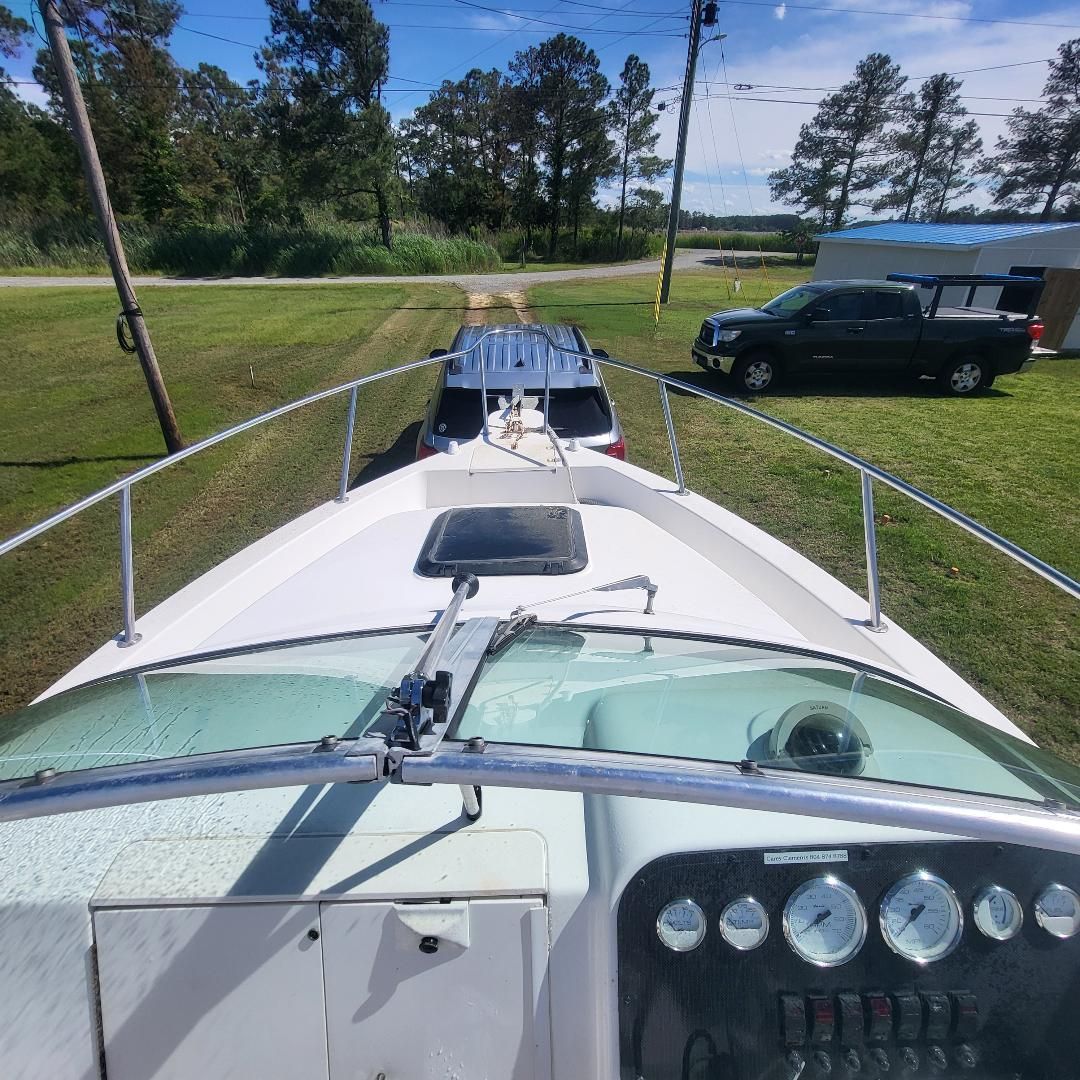 1998 Sport-Craft 211WAC on a trailer, ready for transport.