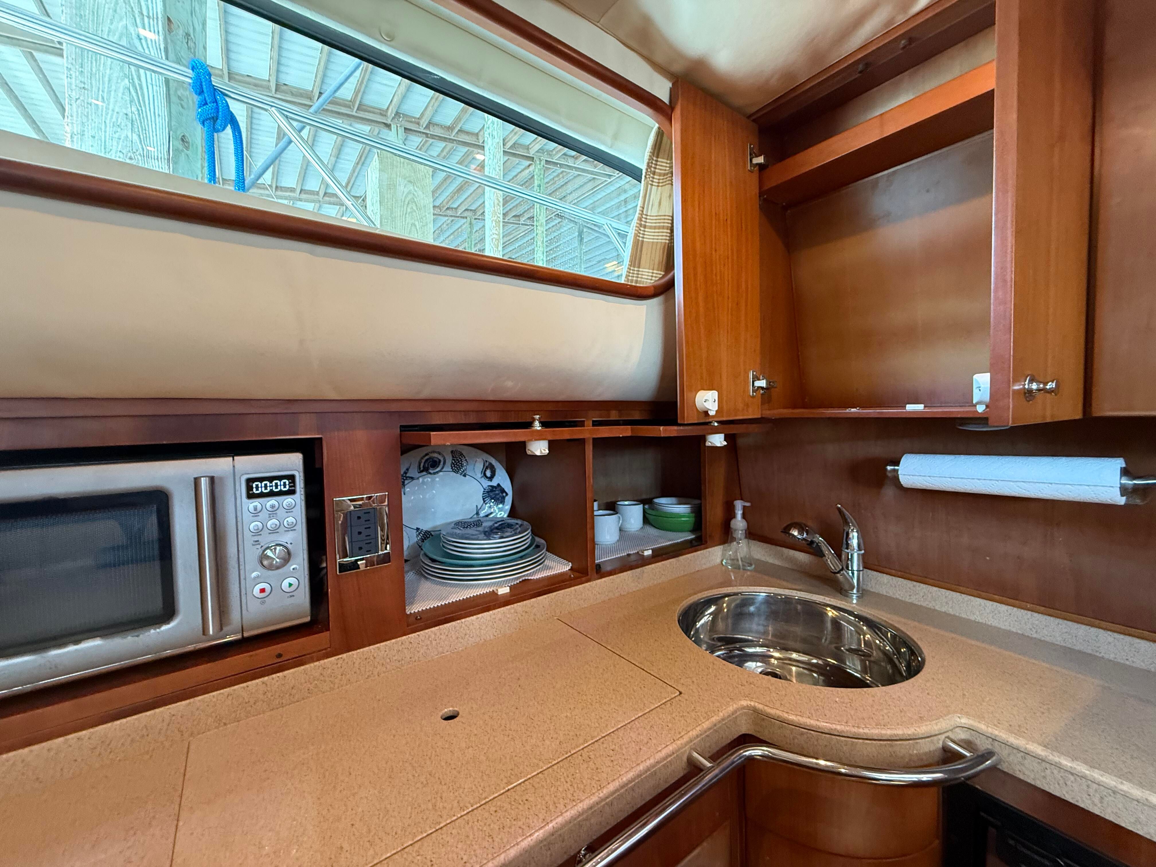 Interior of the 2007 Chris-Craft Roamer 40 with sink and microwave.