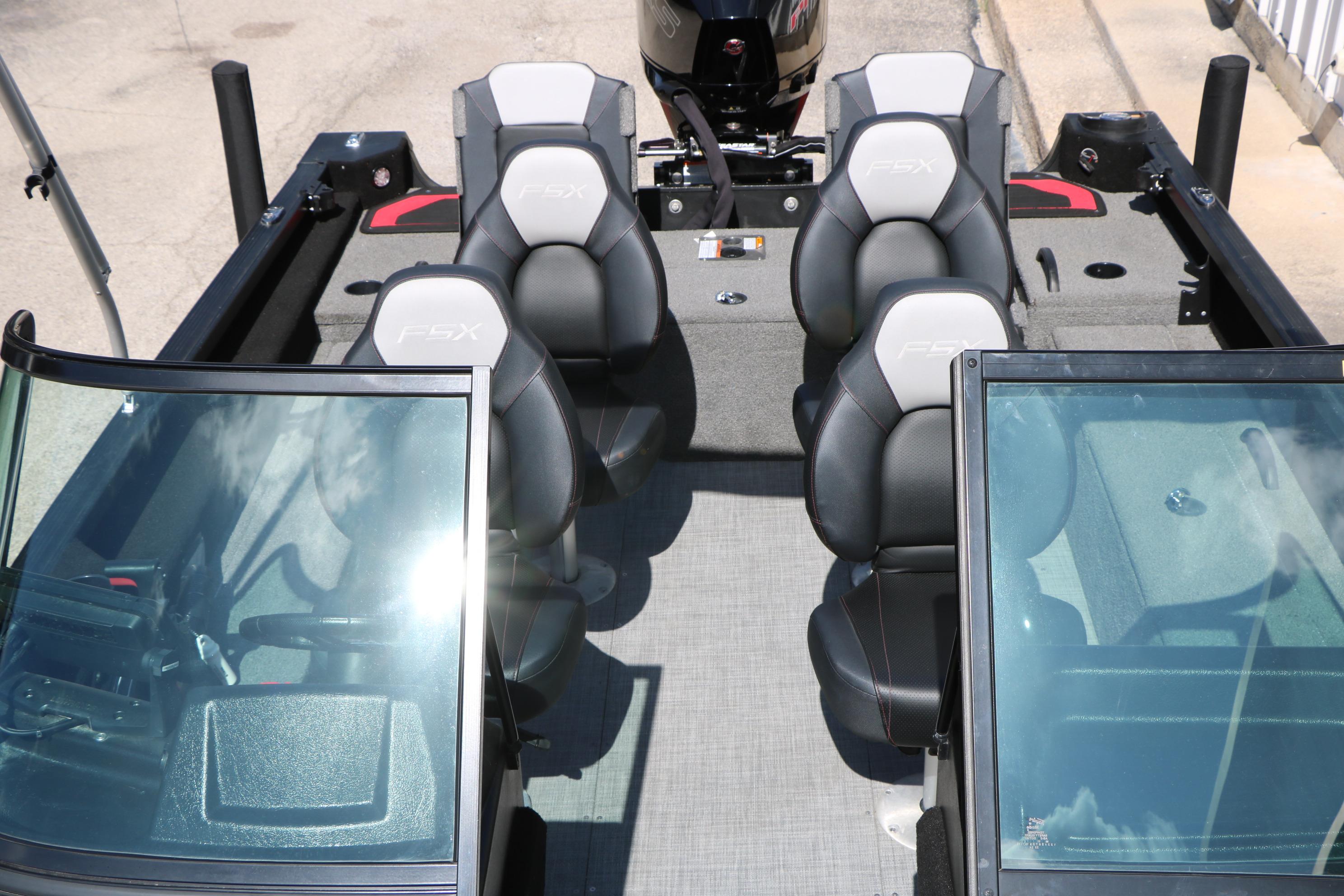2023 Alumacraft Competitor FSX 185 boat interior with four seats and windshield.