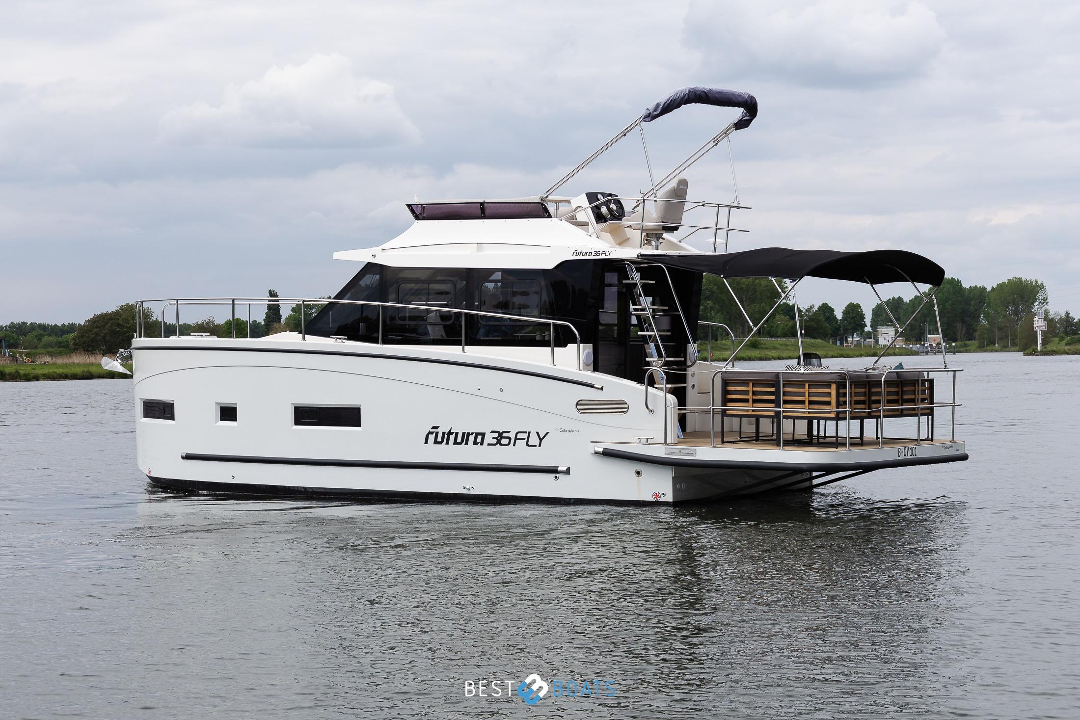 2023 Cobra Yachts Futura 36 Premium Fly cruising on a calm river.