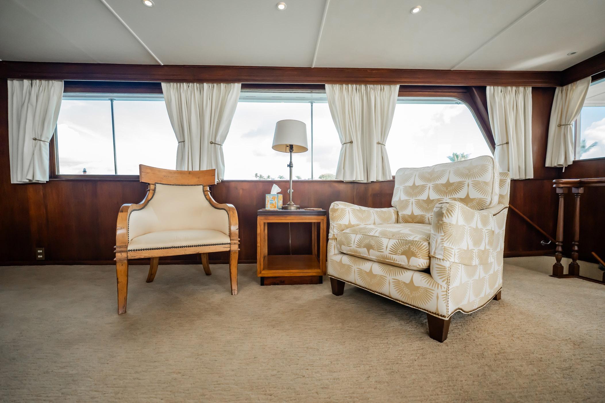Luxurious interior of 1972 Trumpy 72 Motor Yacht with elegant seating and decor.