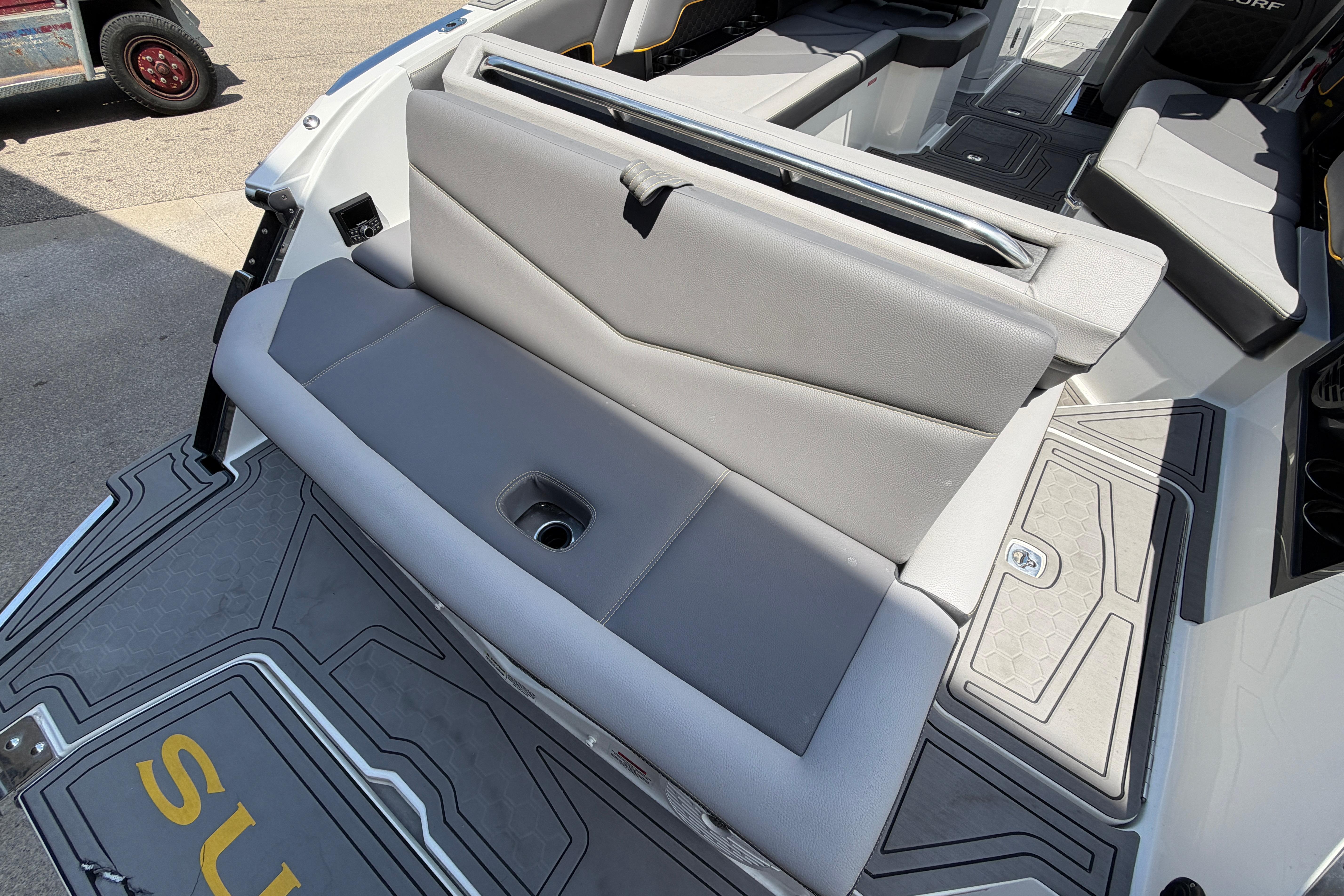 2021 Cobalt R8 Surf boat interior with gray seating and deck details.