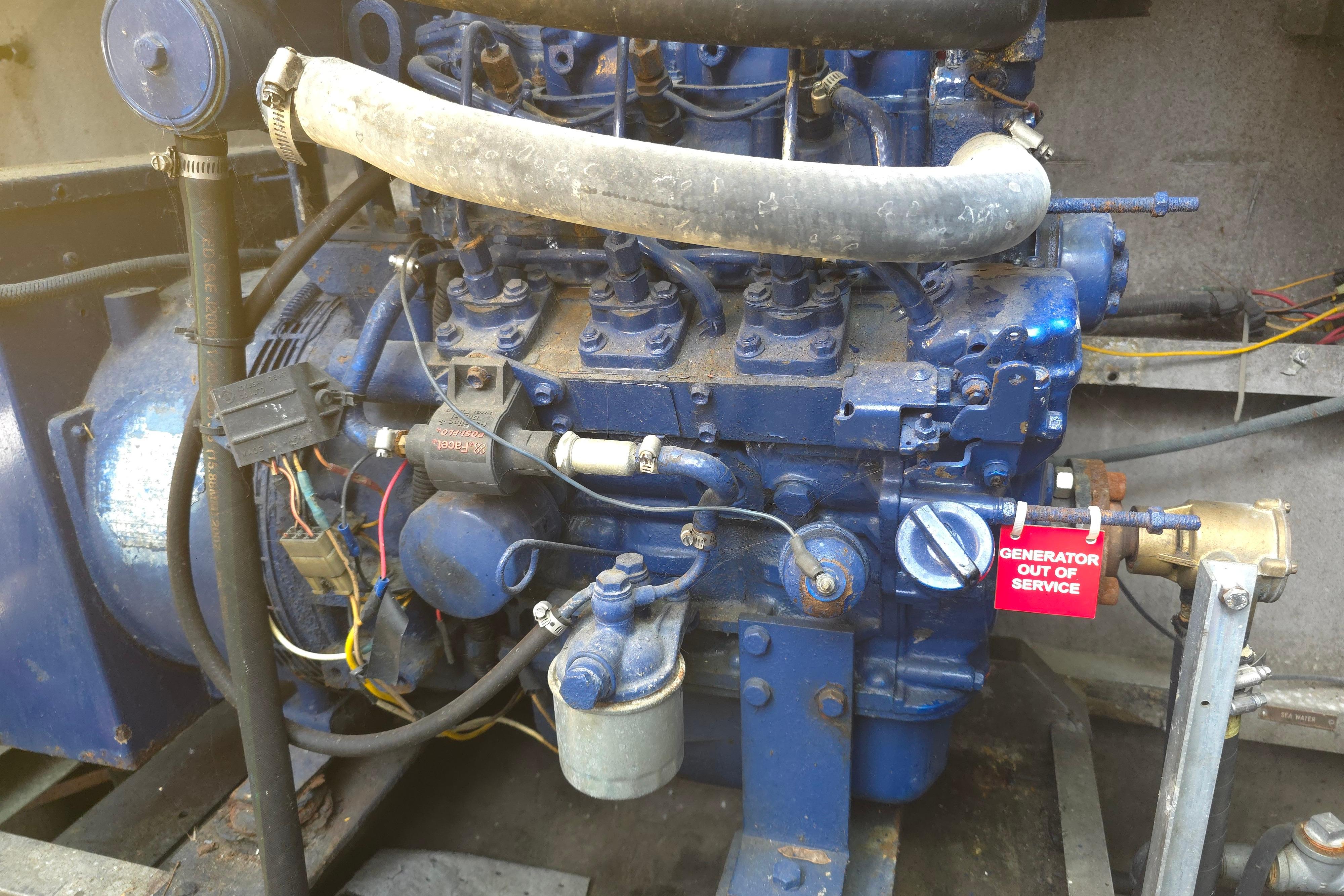 Engine of a 1974 Breaux's Bay Craft Passenger vessel, marked "Generator Out of Service."