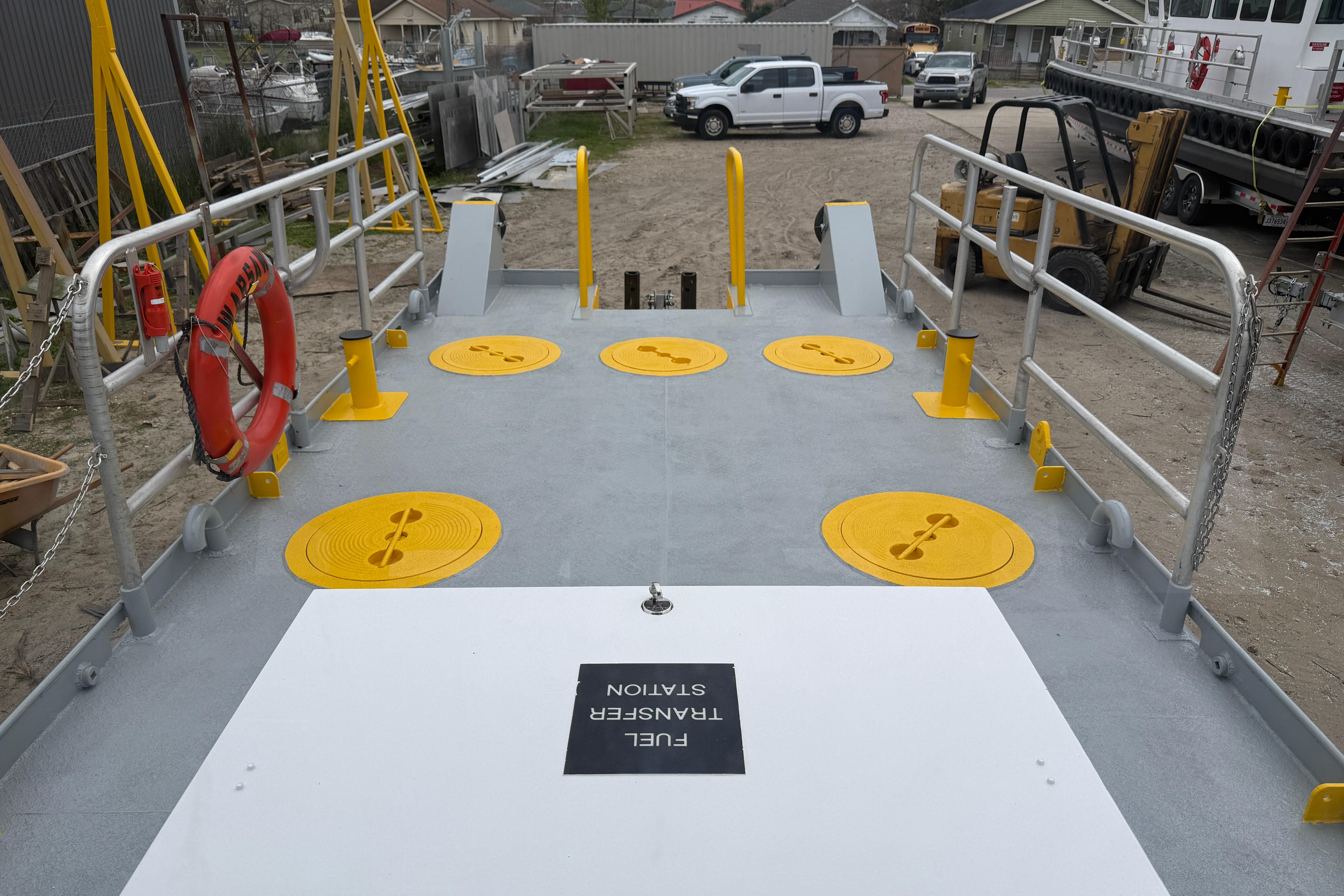 Custom Aluminum Work Boat 34x10, 2010 model, featuring deck with safety railings and equipment.