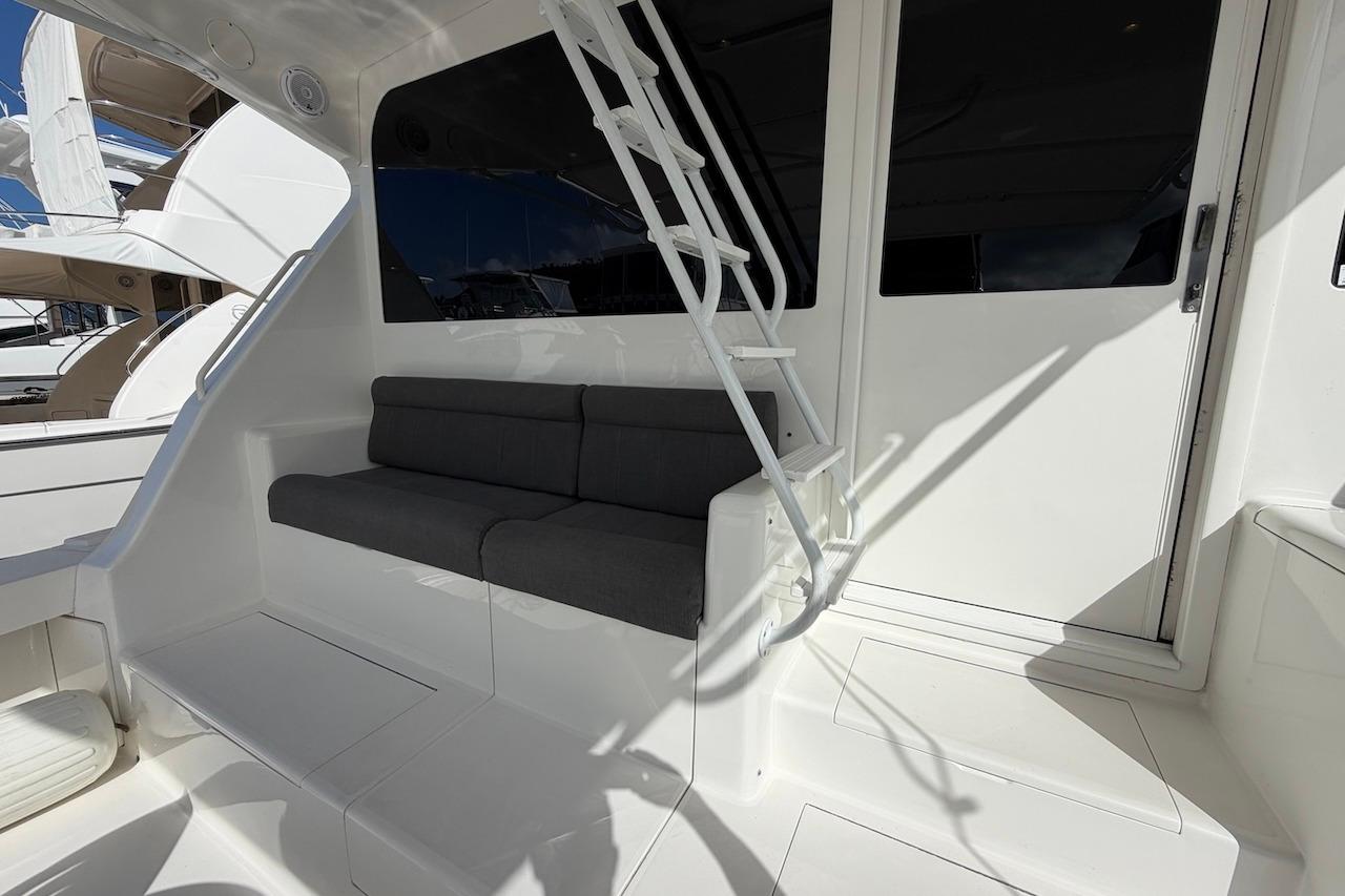 Interior view of 1999 Viking 58 Convertible yacht with seating and ladder.