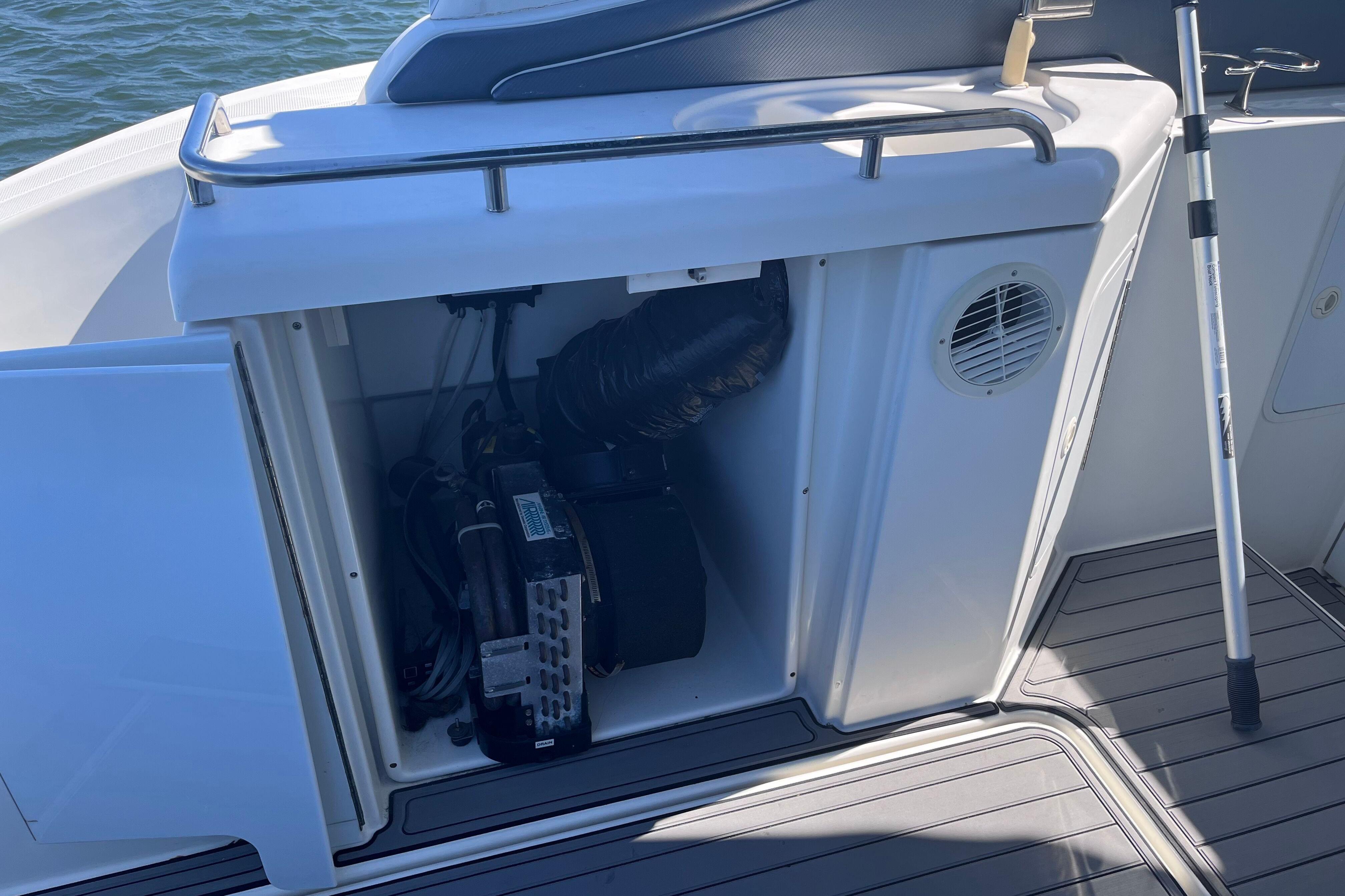 2007 Cruisers Yachts 370 Express engine compartment with open hatch, showing internal components.