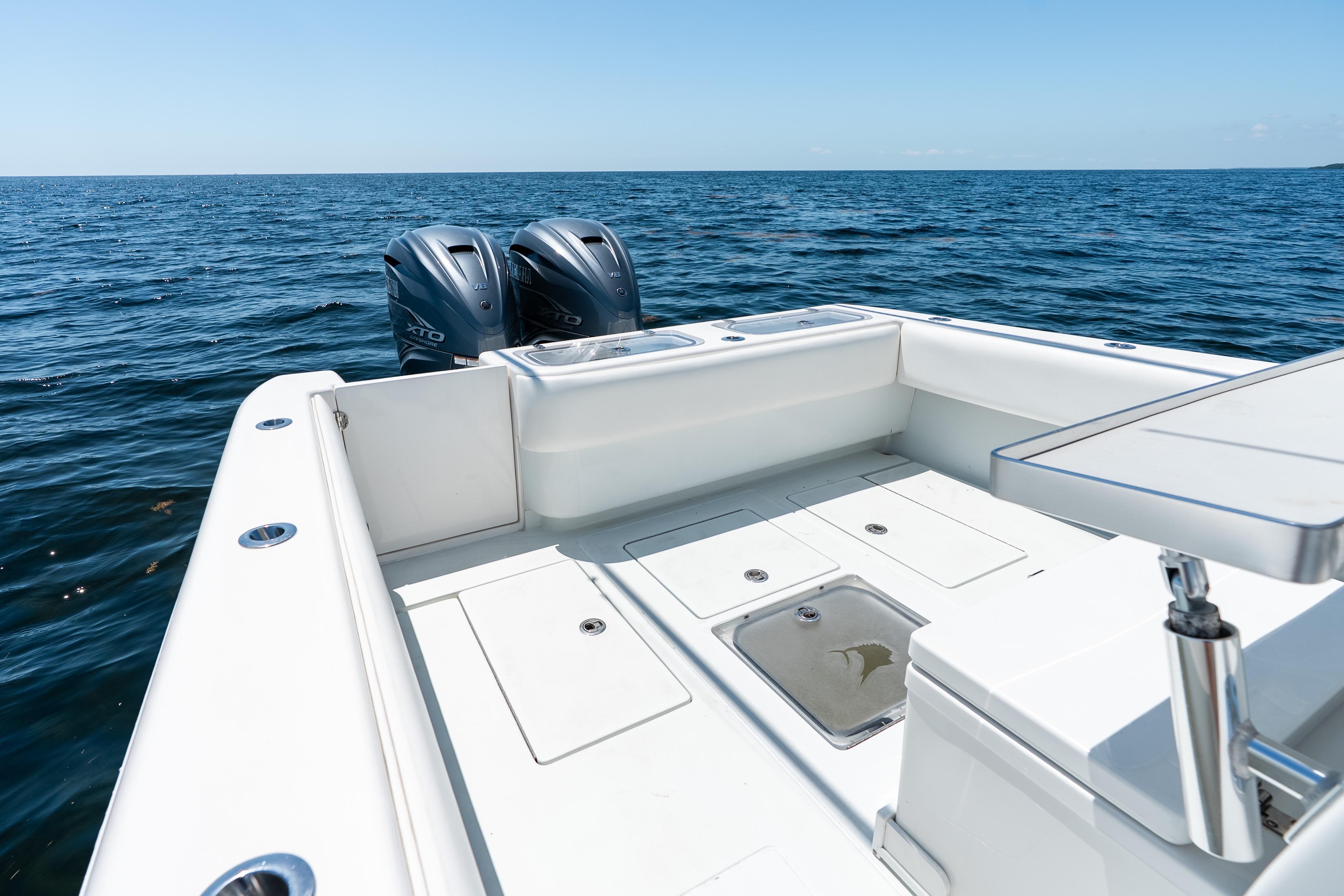 2022 Contender 35 ST boat with dual outboard motors on open ocean.