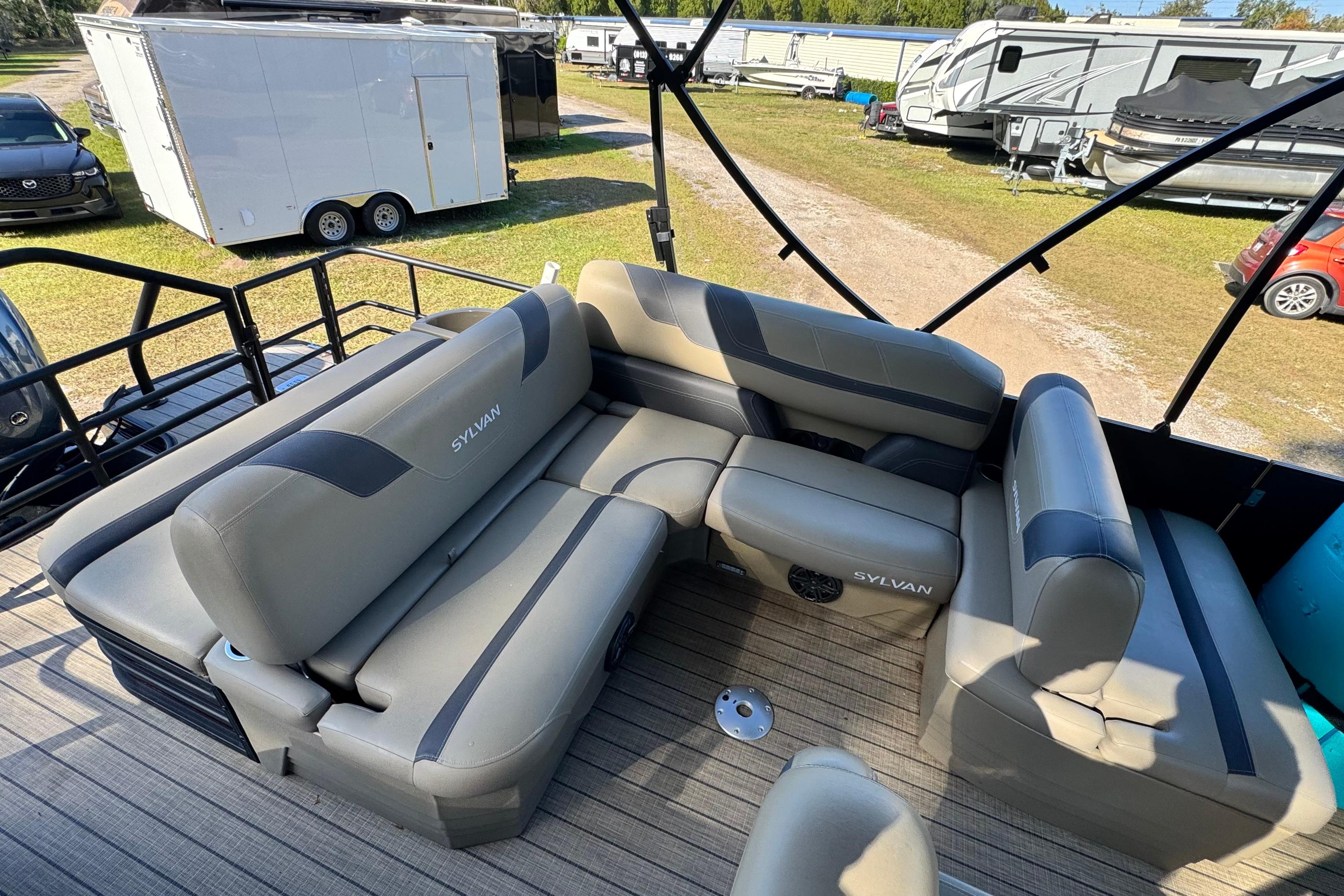 Luxurious seating on 2023 Sylvan L5 CLZ pontoon boat, showcasing spacious and comfortable design.