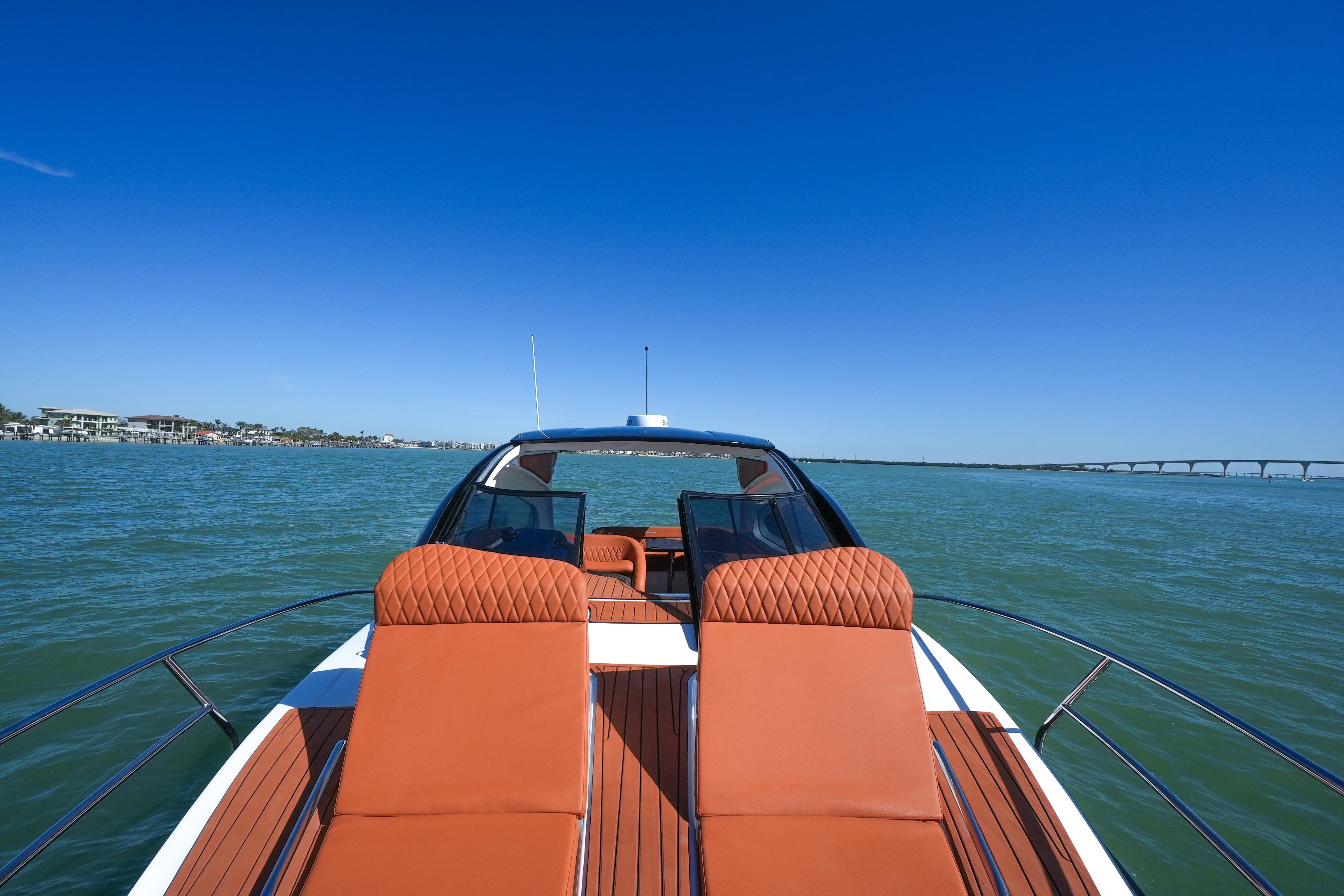 Luxurious Hanover 355 yacht cruising on open water, 2026 model, with elegant seating.