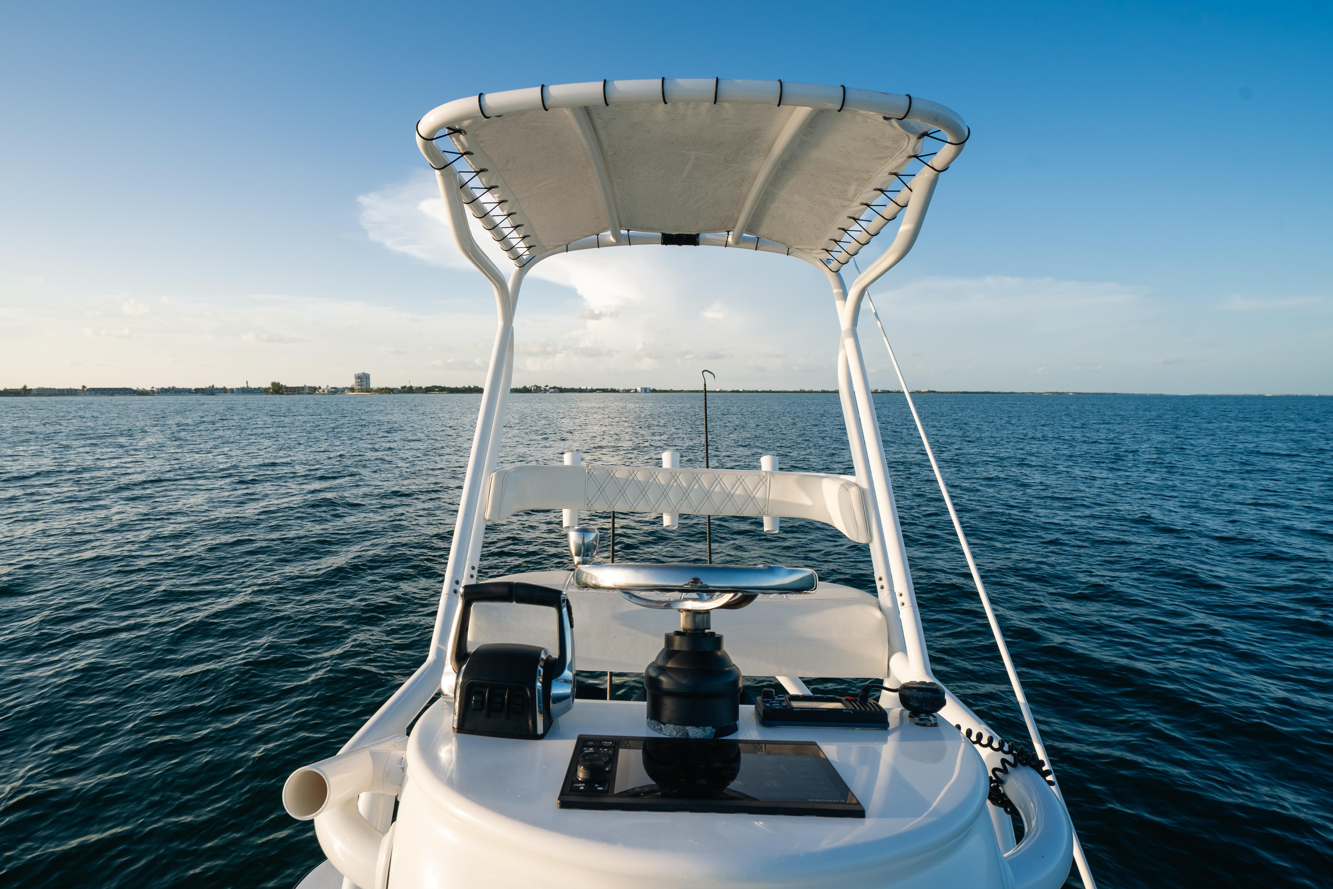 2023 Front Runner 36 Center Console boat on open water, clear sky.