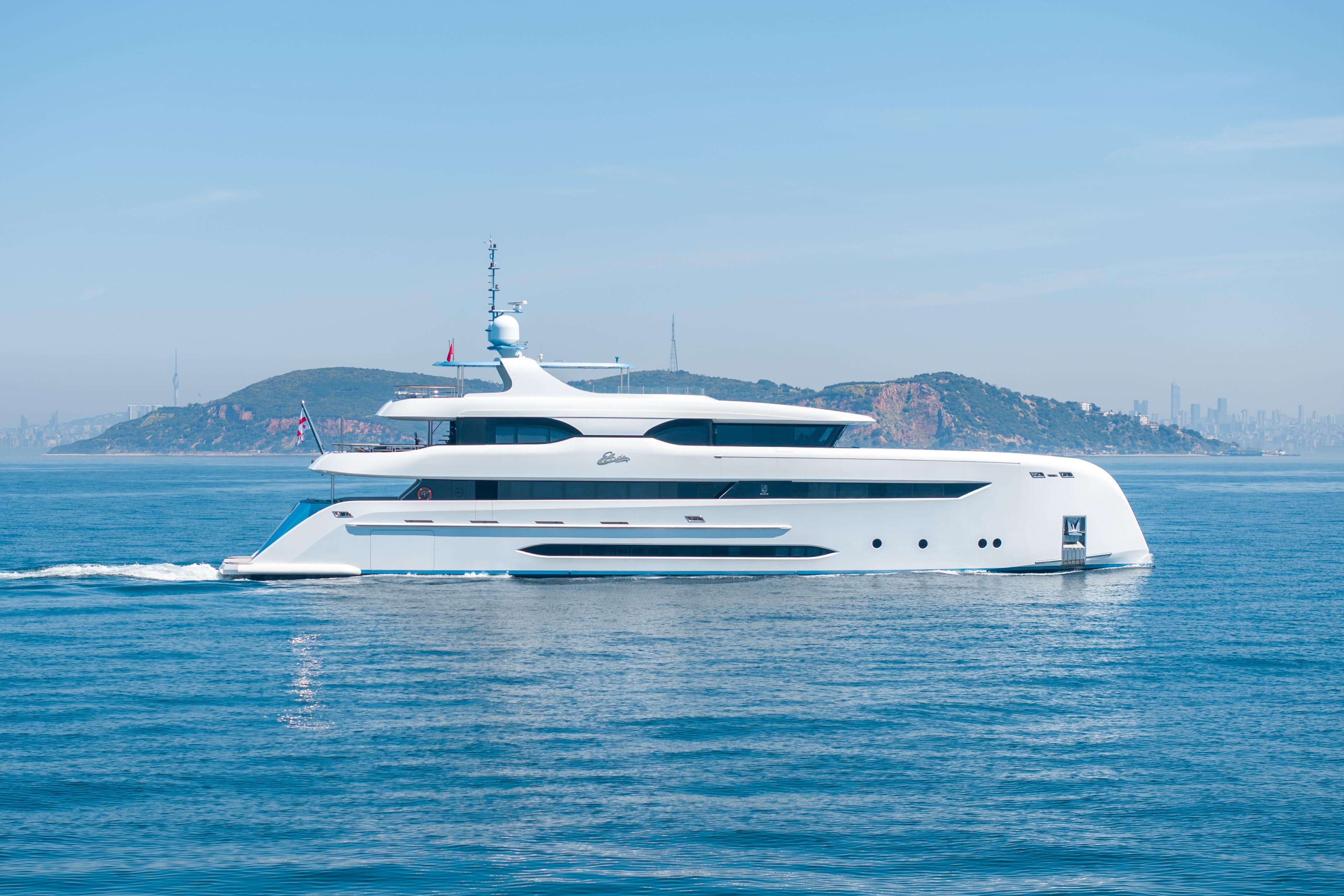Luxurious 2014 Bilgin 147 yacht cruising near scenic coastline.