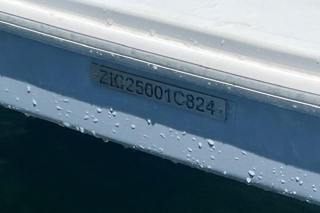 2024 Bracewell 25 boat hull identification number with water droplets.