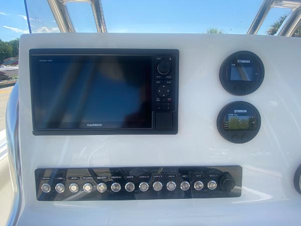 2024 Key West 239 FS boat dashboard with Garmin and Yamaha displays.