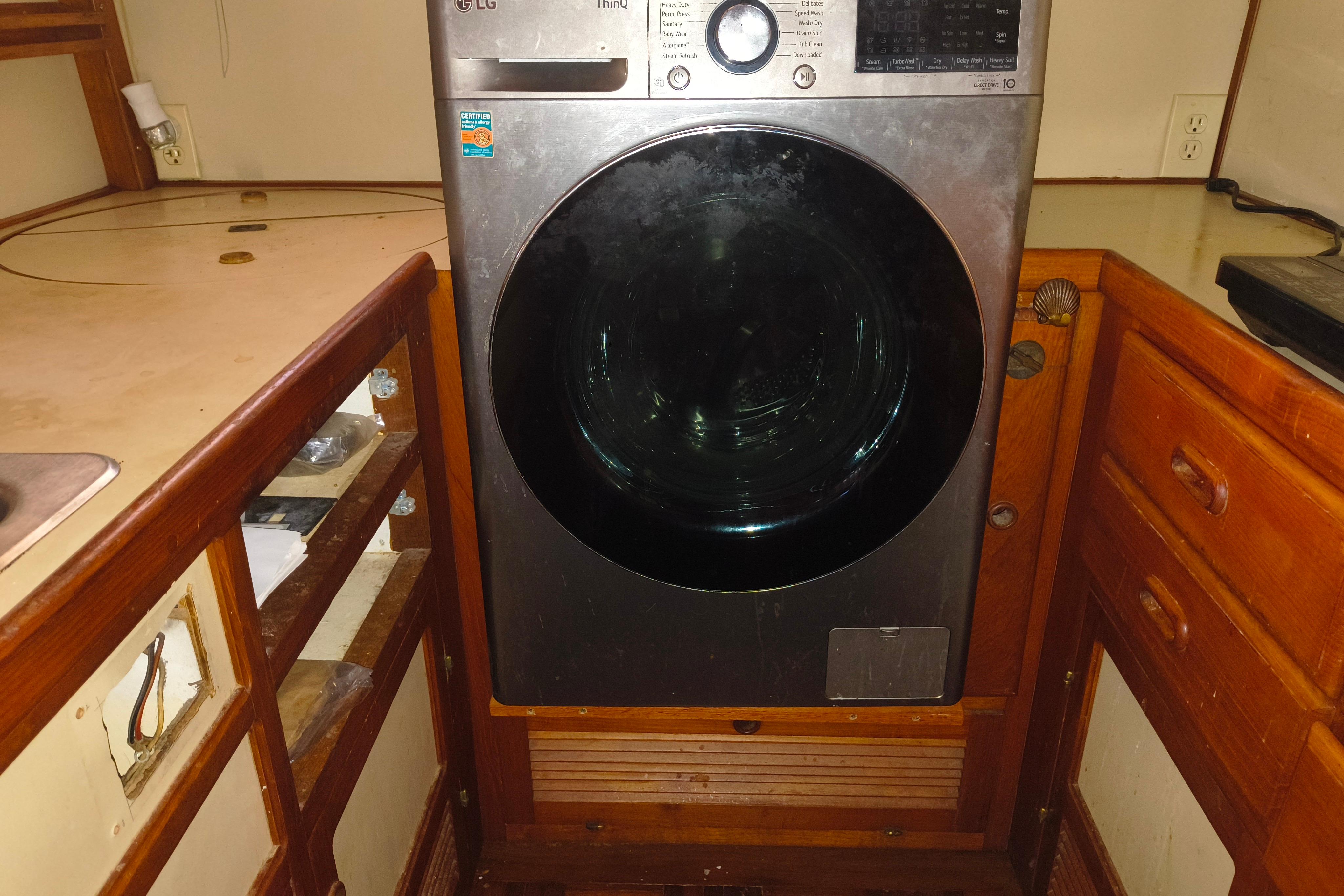 Laundry area with LG washer in 1984 Kadey-Krogen Manatee boat interior.
