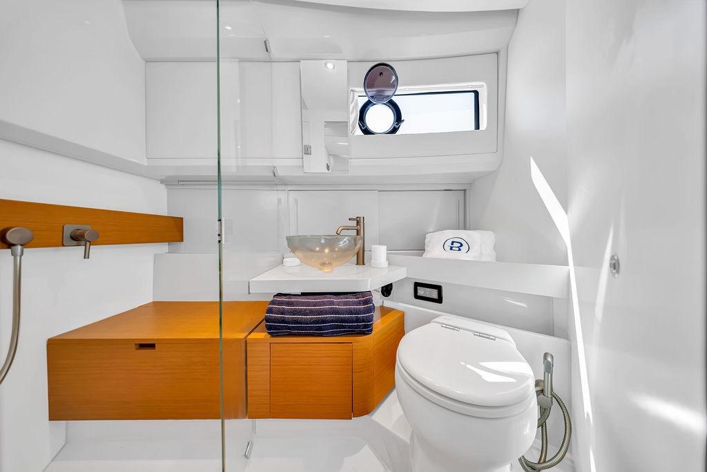 Luxurious bathroom interior of 2021 Bluegame BG 42 yacht with modern fixtures and elegant design.
