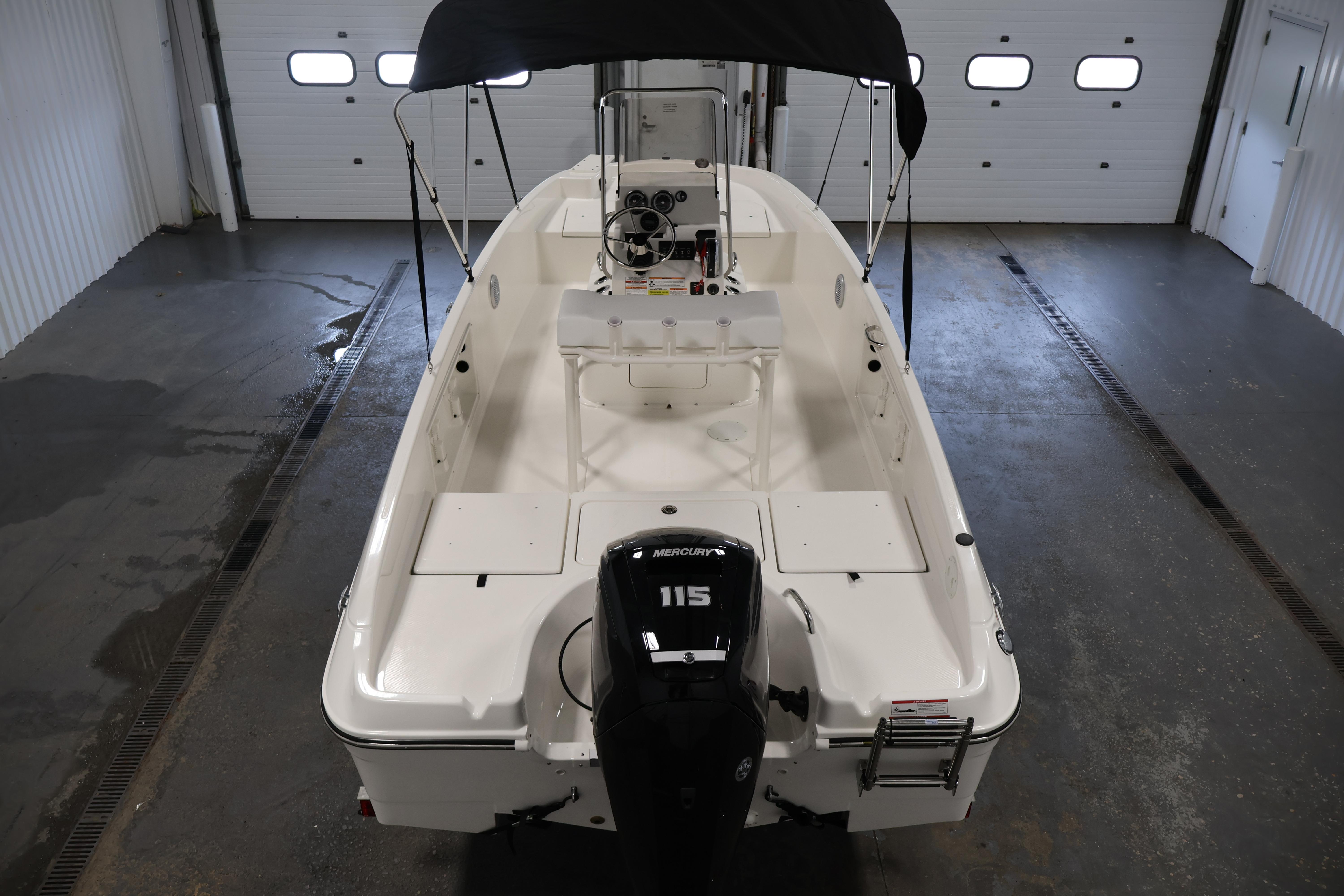 2026 Bayliner Trophy T18 boat with Mercury 115 engine in a garage setting.
