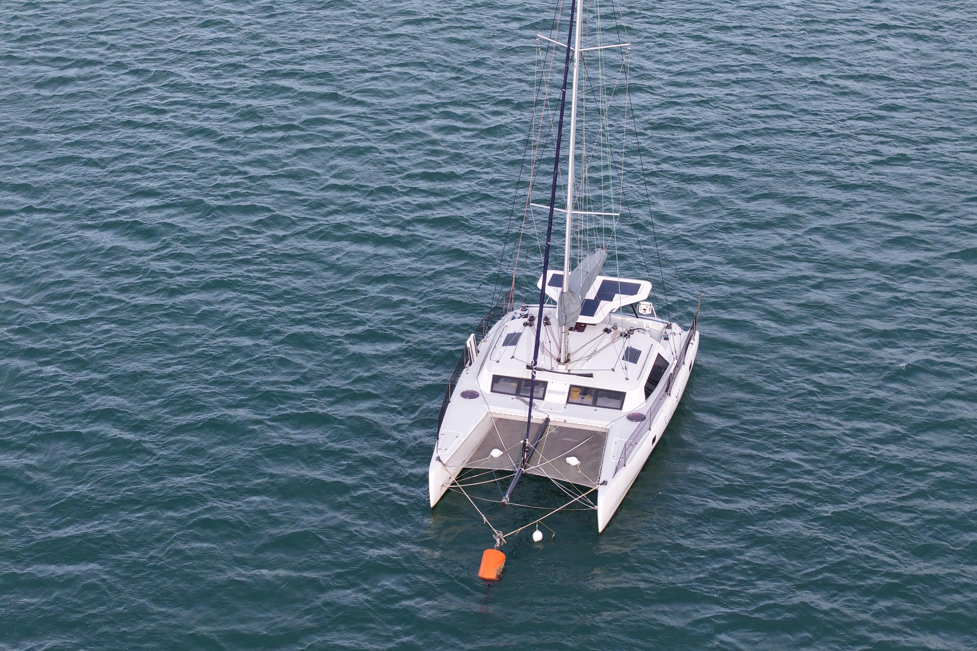 Aerial view of 2011 Dazcat 1195 catamaran sailing on open water.