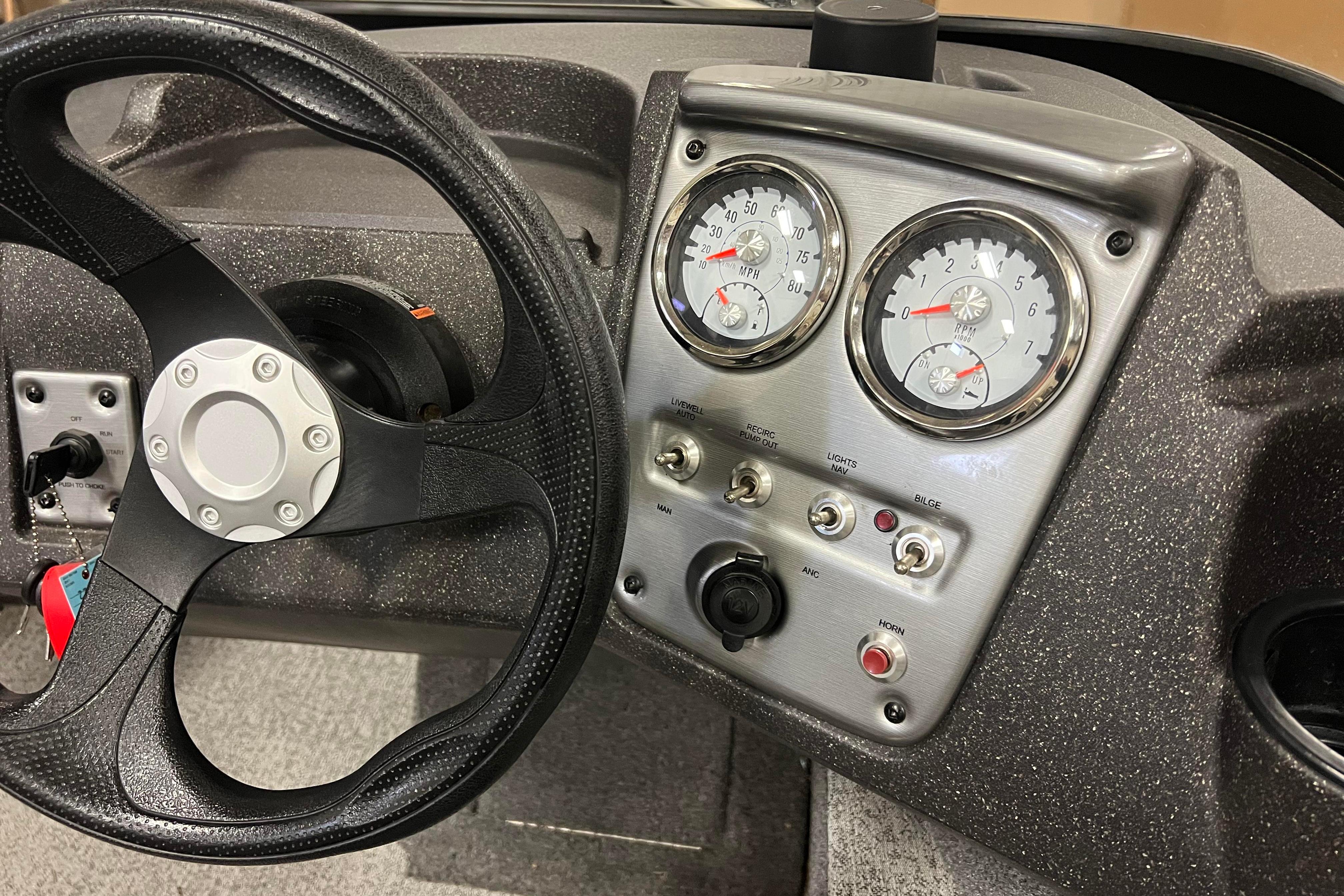 2022 Tracker Pro Guide V-16 WT dashboard with steering wheel and instrument panel.
