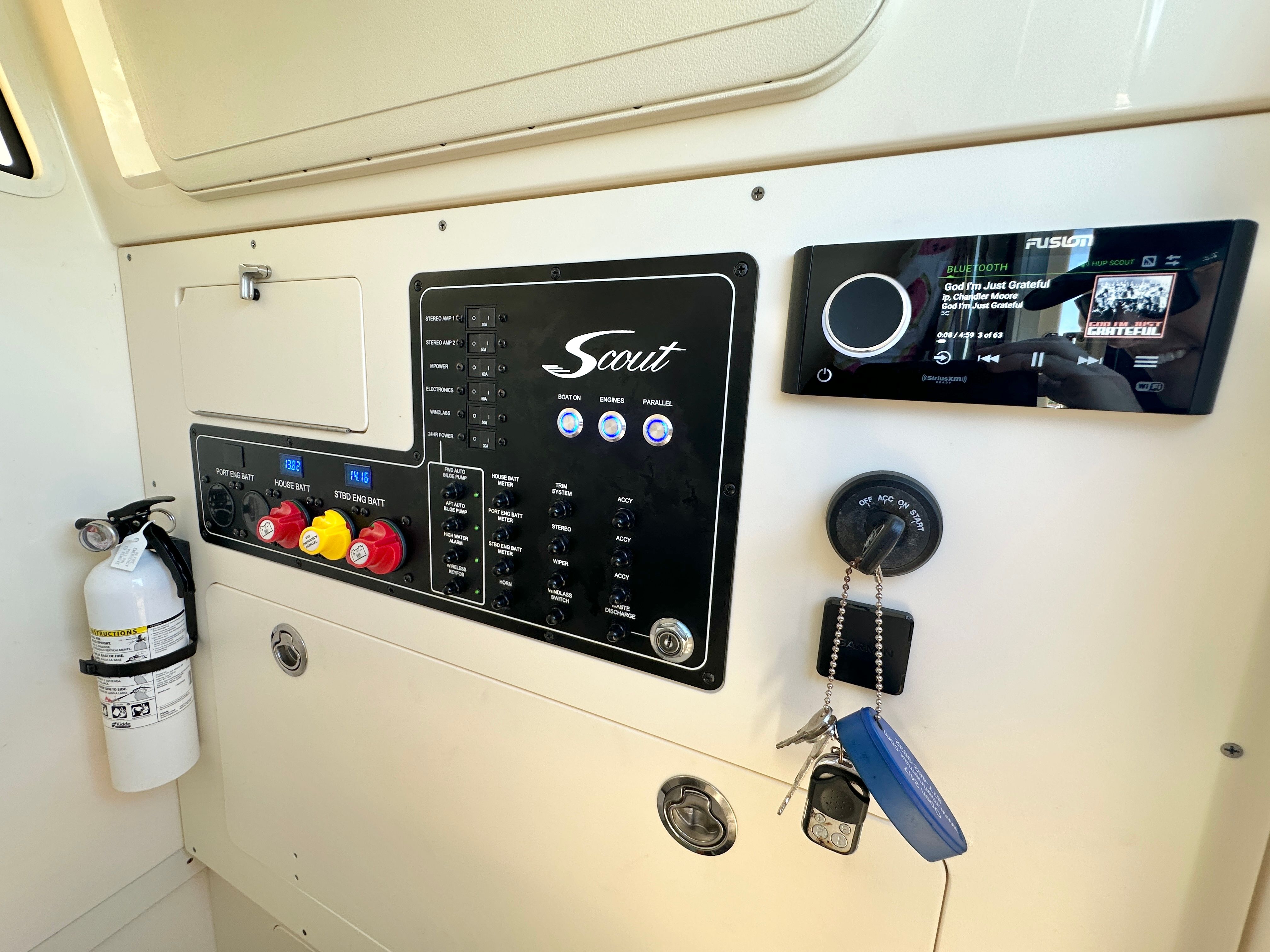 Dashboard of a 2024 Scout 281 XSS with switches and a music system.