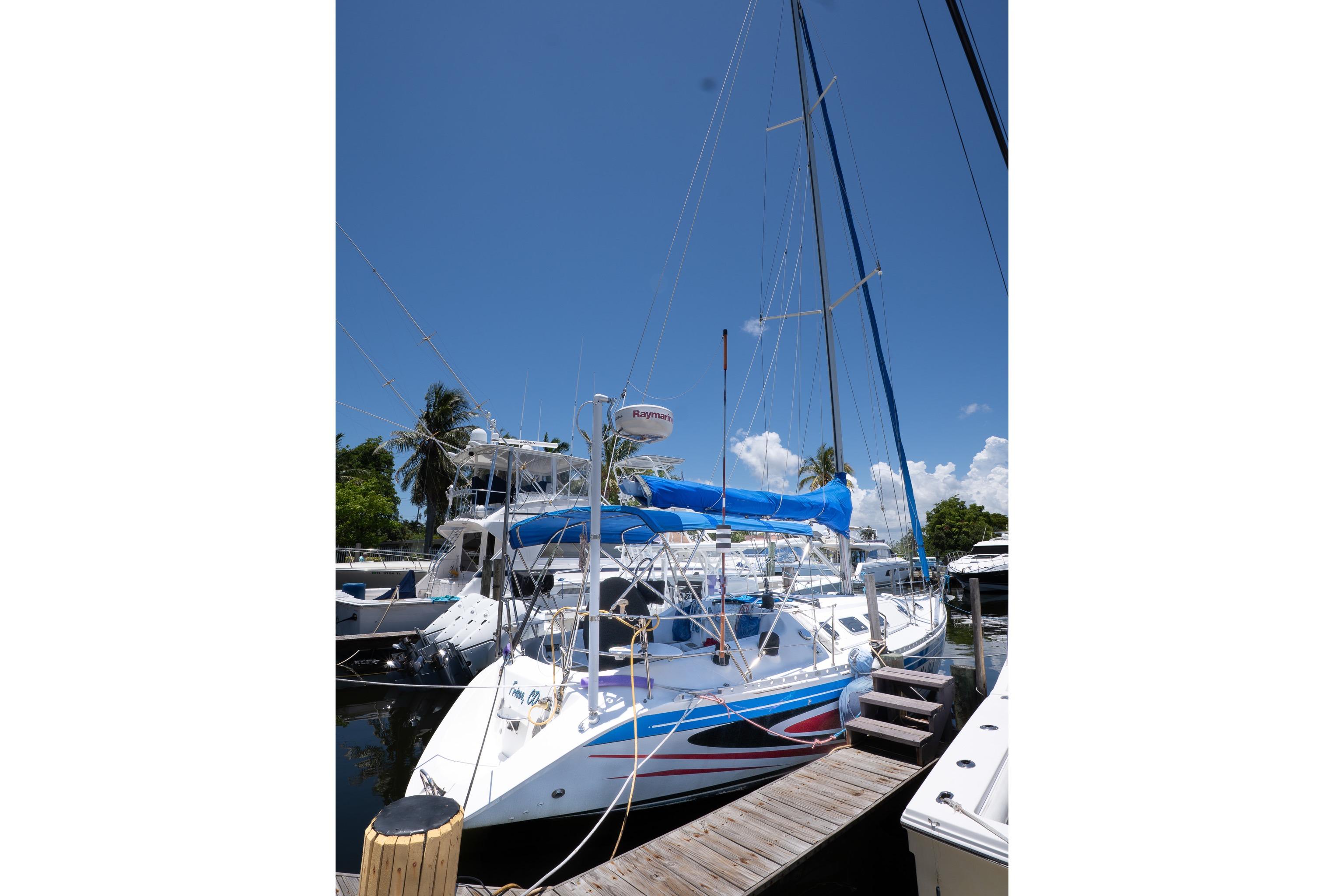 Sailboat docked under clear sky, 1993 Beneteau First 38 s5 model.