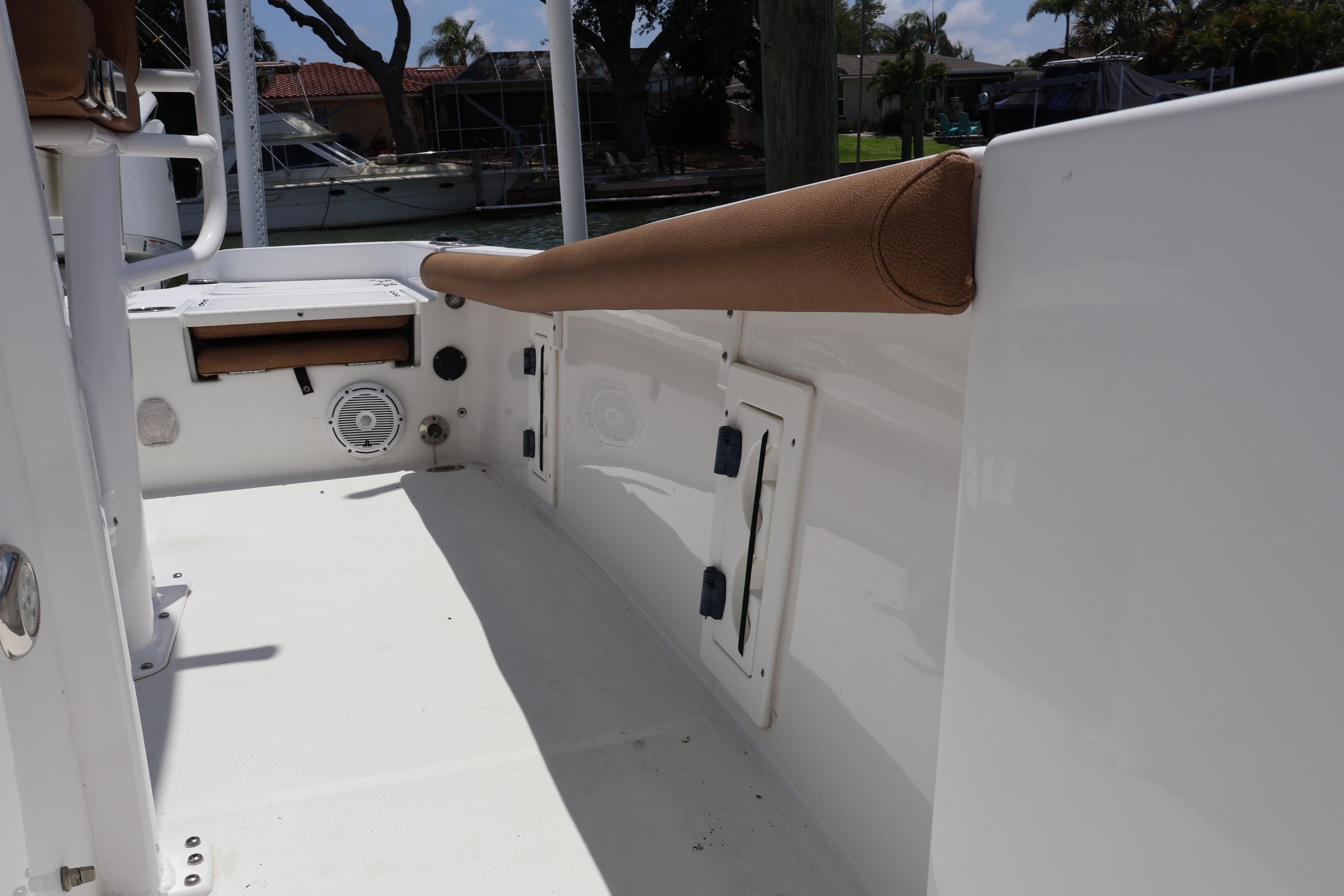 2022 Sea Hunt BX 25 FS boat interior with storage compartments and speaker.