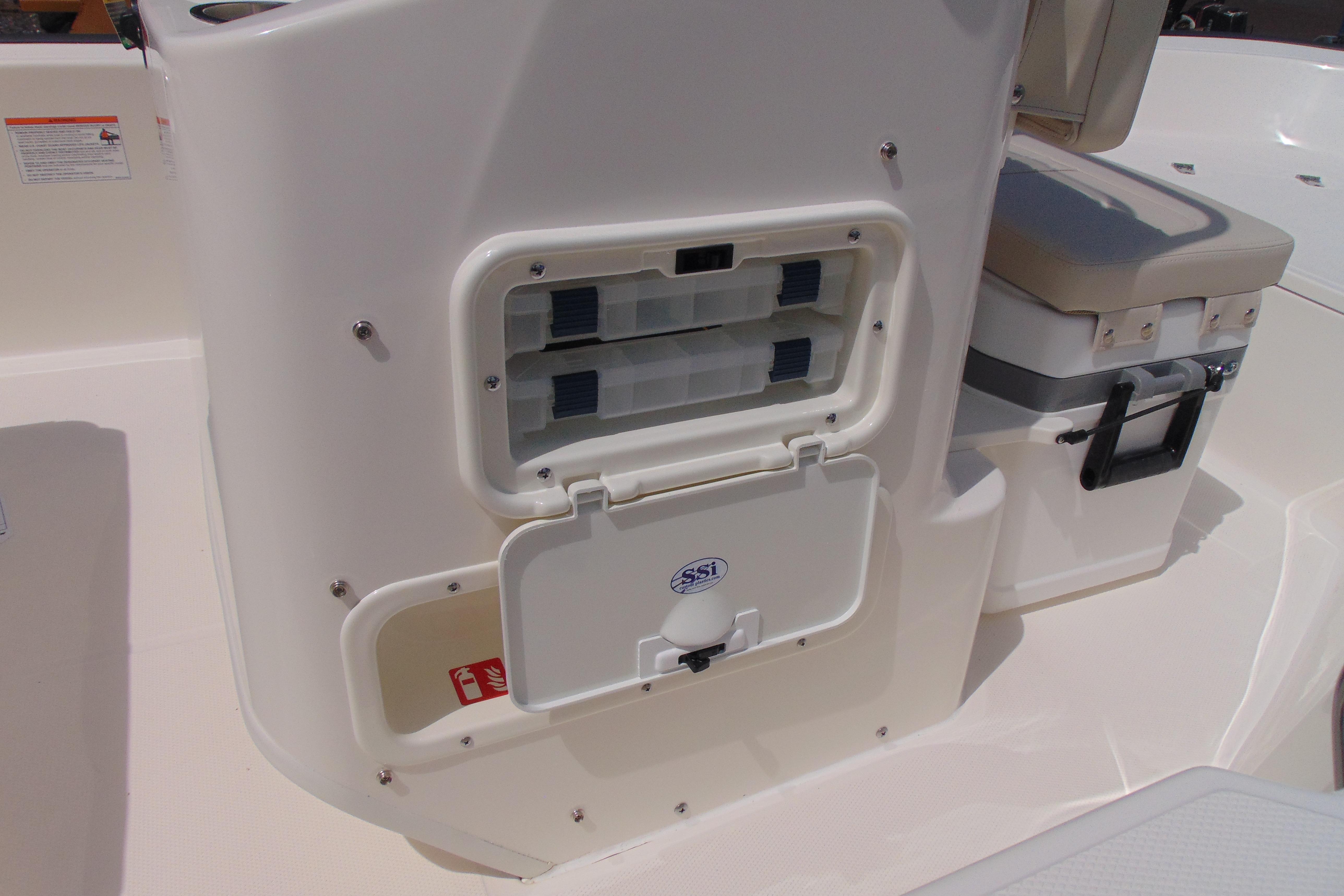 2026 Boston Whaler 150 Montauk boat interior with storage compartments and seating.