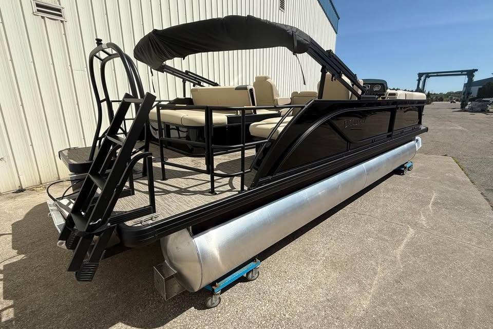 2026 Godfrey Sweetwater 2286 SFLC pontoon boat with canopy and seating, docked outdoors.