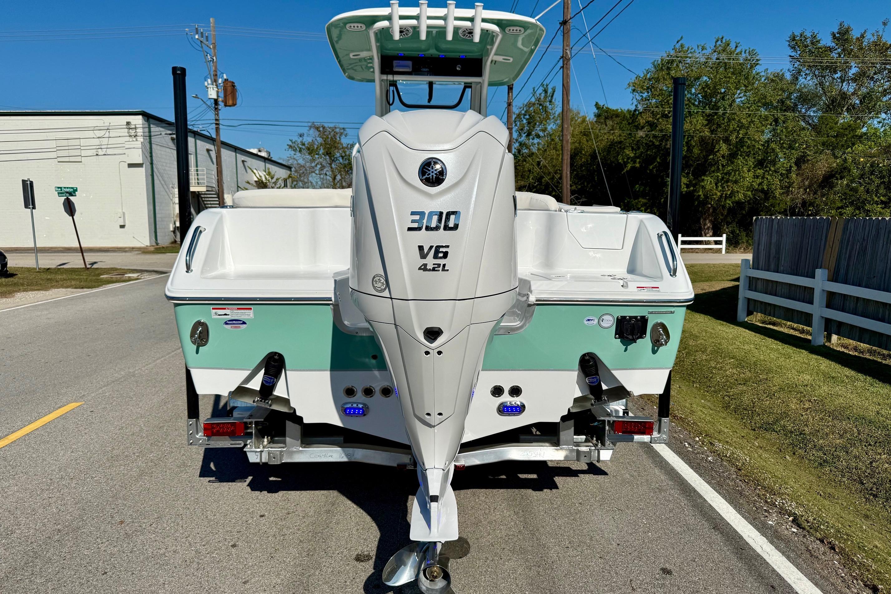 2026 Sea Hunt Ultra 255 SE boat with Yamaha 300 V6 engine on a trailer.