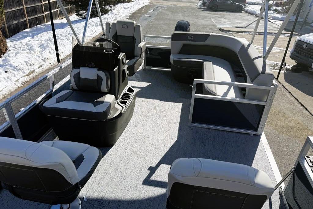 2026 Sun Tracker Bass Buggy 16 XL Select pontoon boat with spacious seating and modern design.