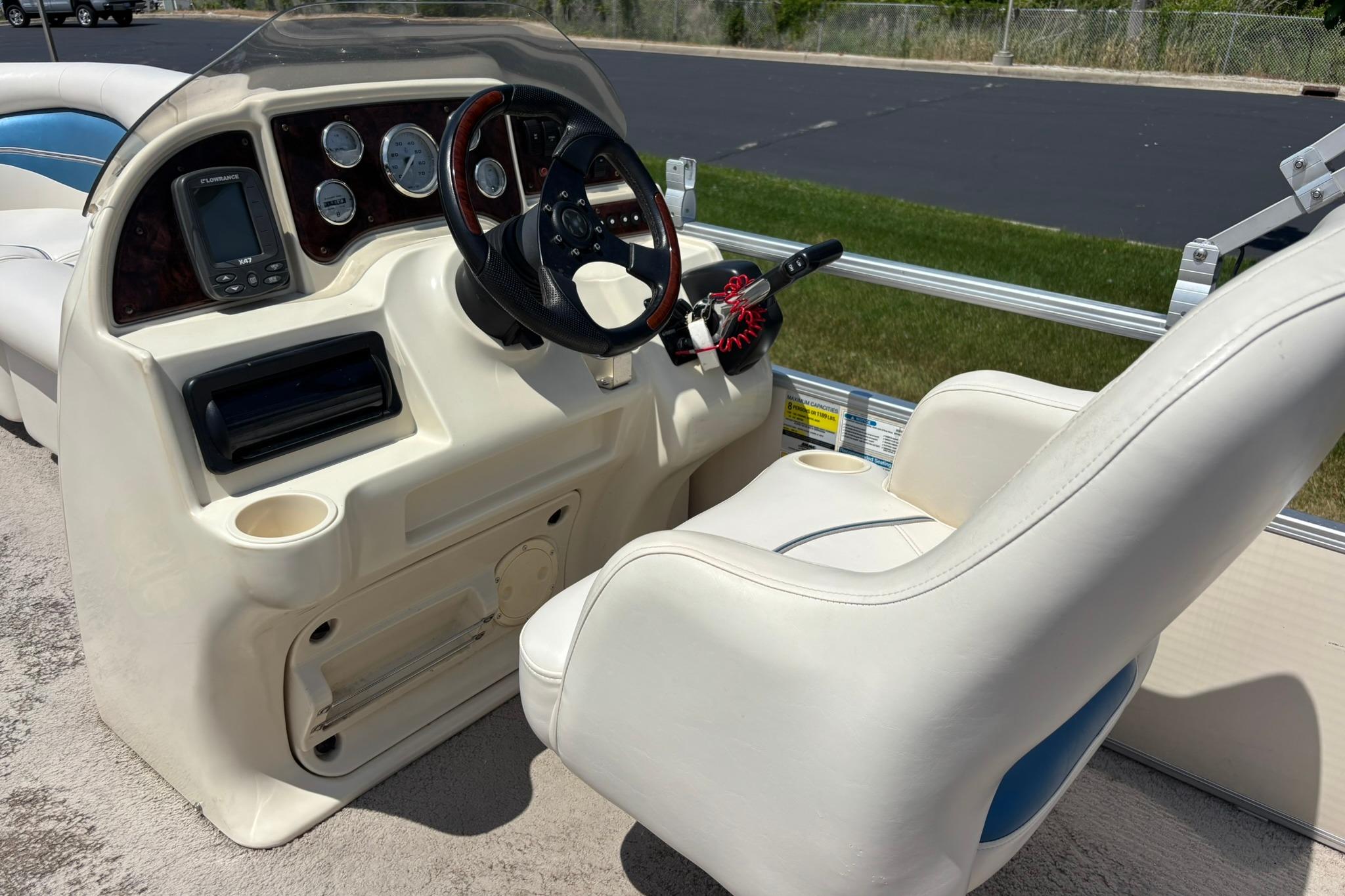 Interior of a 2007 Sweetwater SW 1986 RE-3 Gate boat with steering console.
