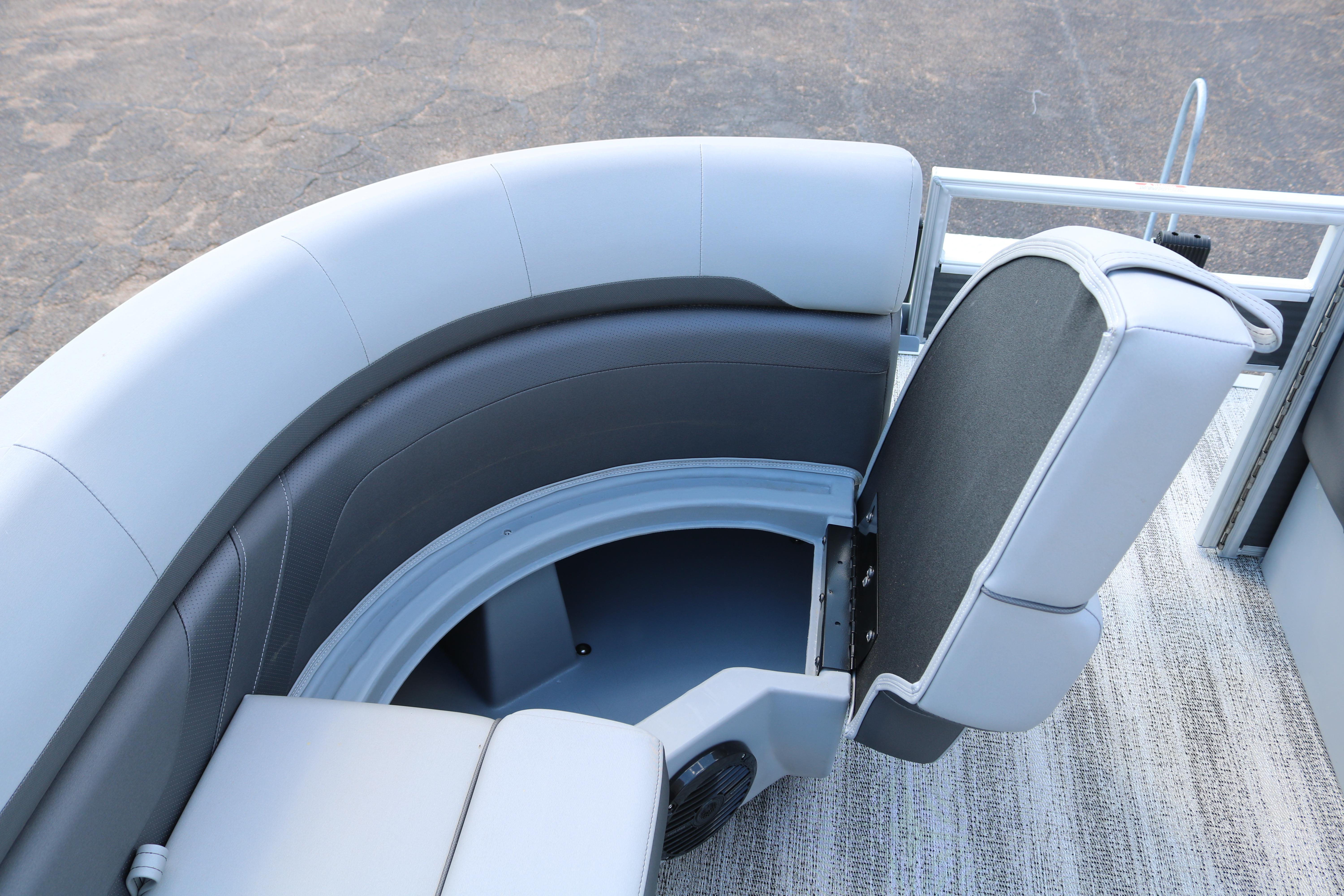 2026 Bennington 20SXSNP REAR FISH boat seating with storage compartment open.