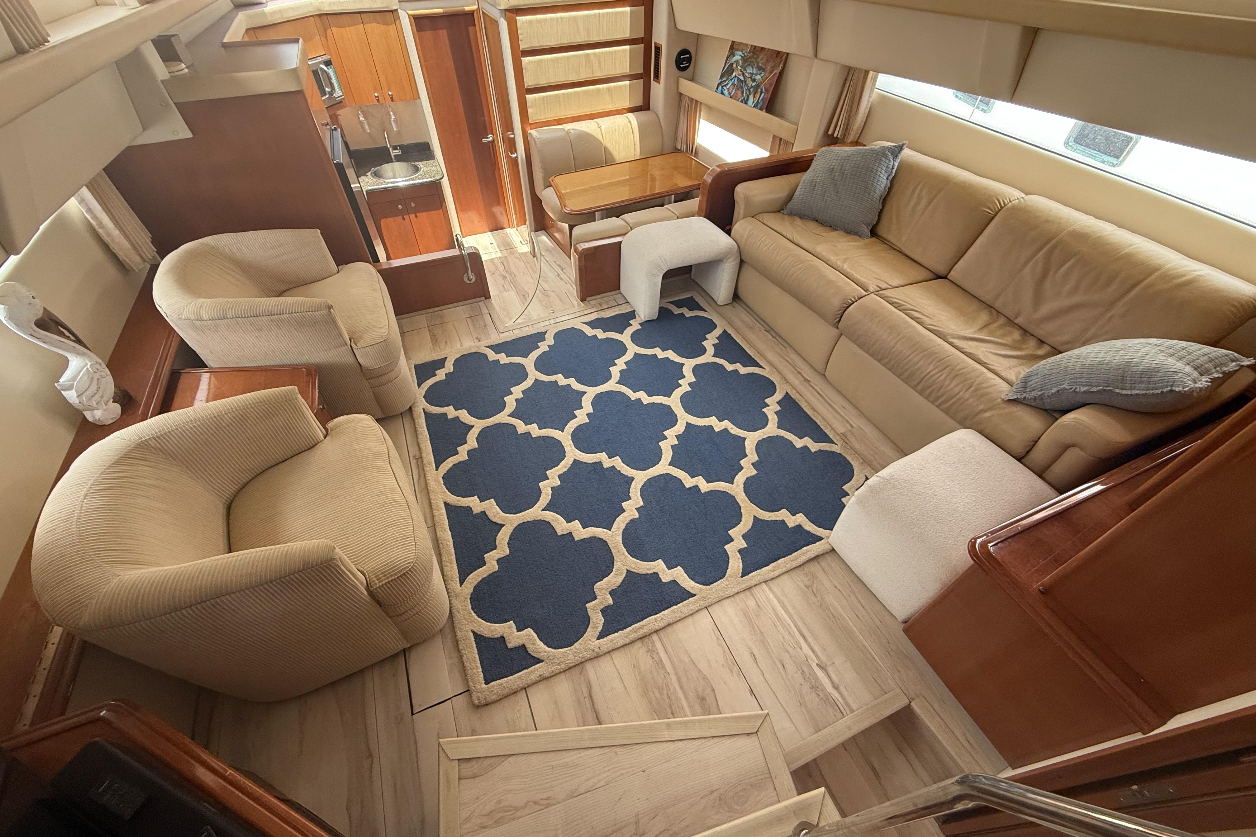 Luxurious interior of 2006 Carver 43 Motor Yacht with plush seating and elegant decor.