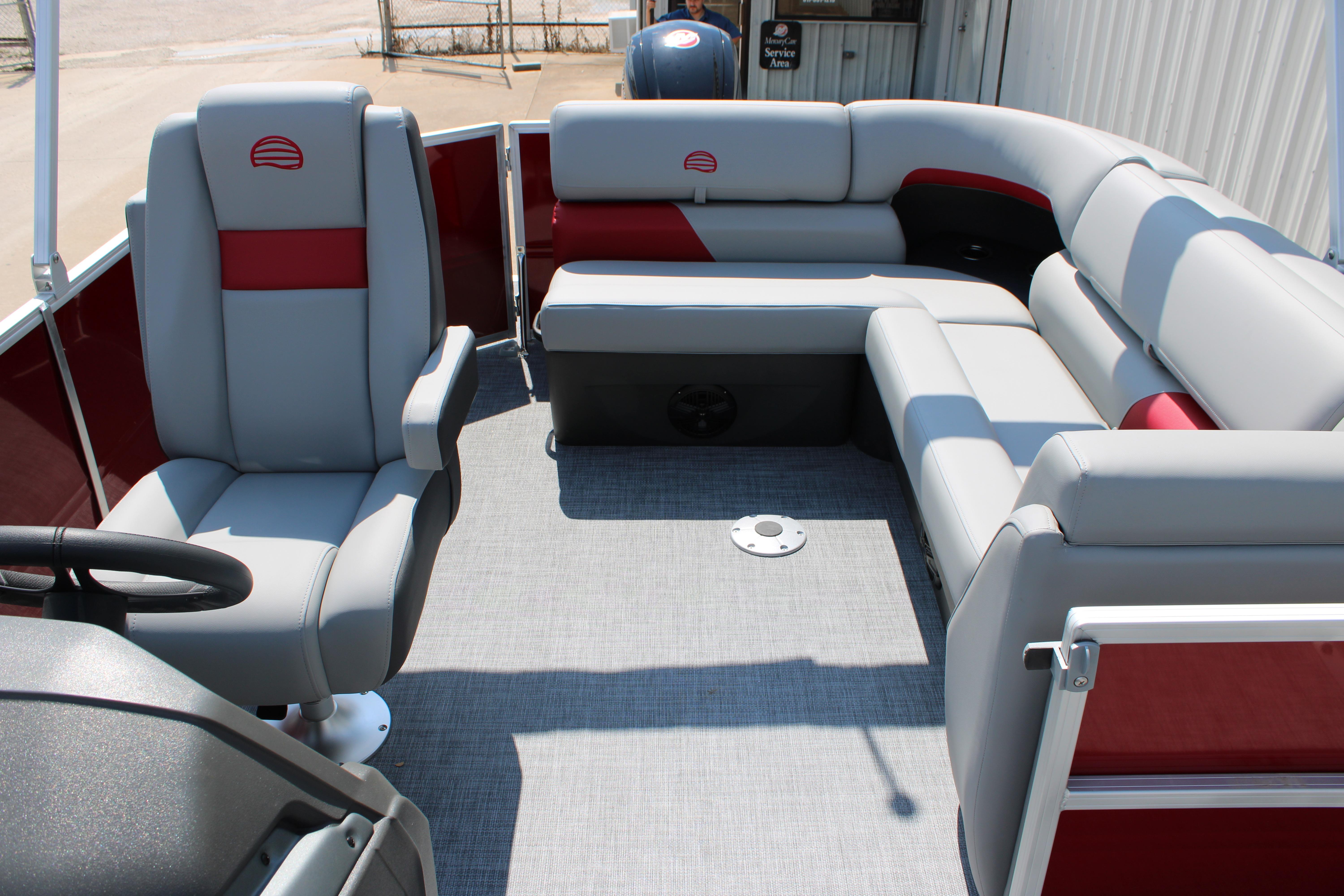 2026 Sun Tracker Party Barge 20 DLX interior with gray and red seating, spacious layout.