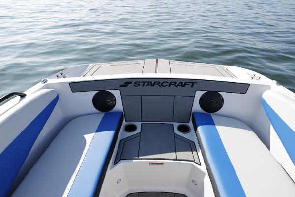 2025 Starcraft SV 16 OB boat interior with blue and gray seating on calm water.