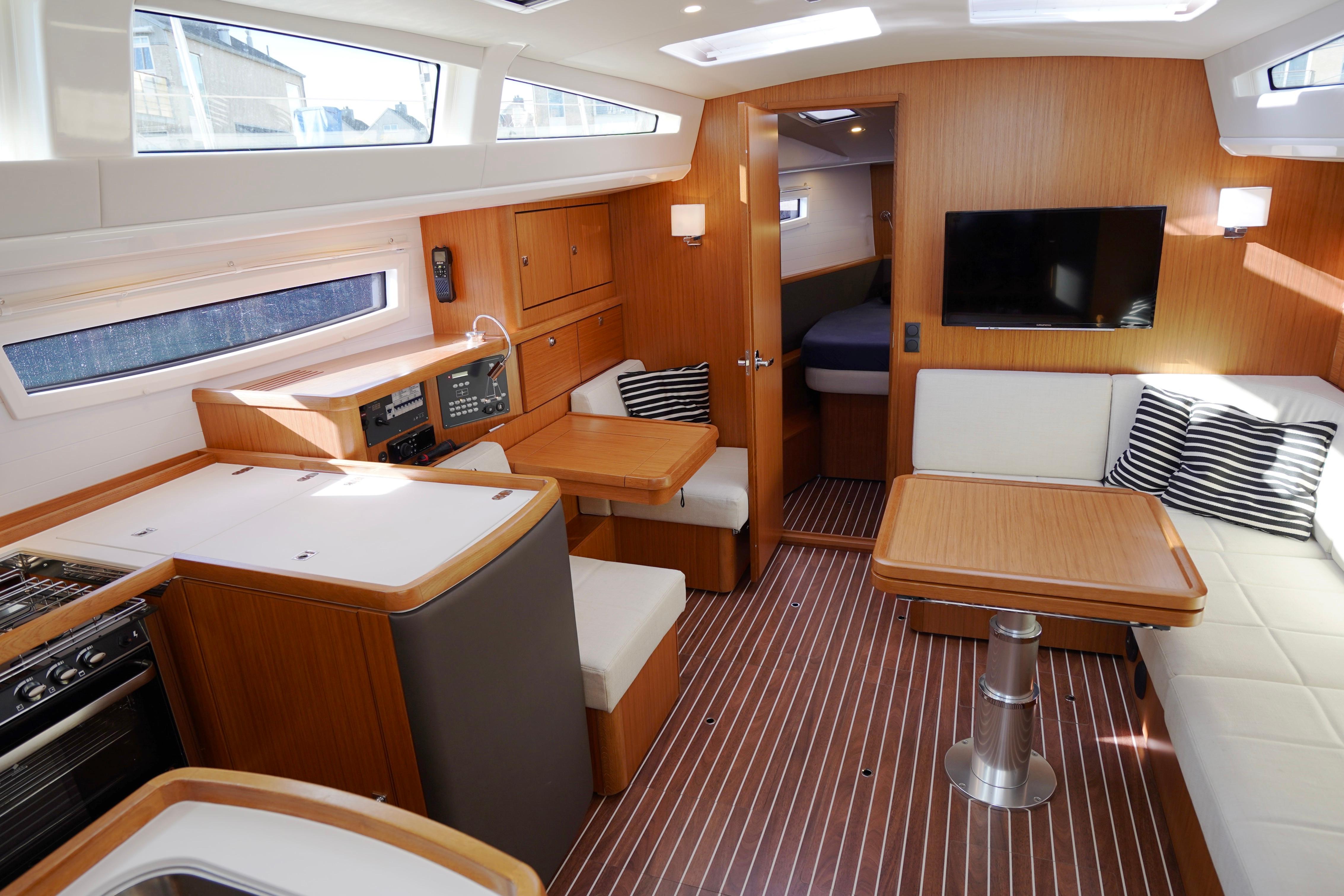 Luxurious interior of 2019 Bavaria Vision 42 yacht with modern furnishings and ample natural light.