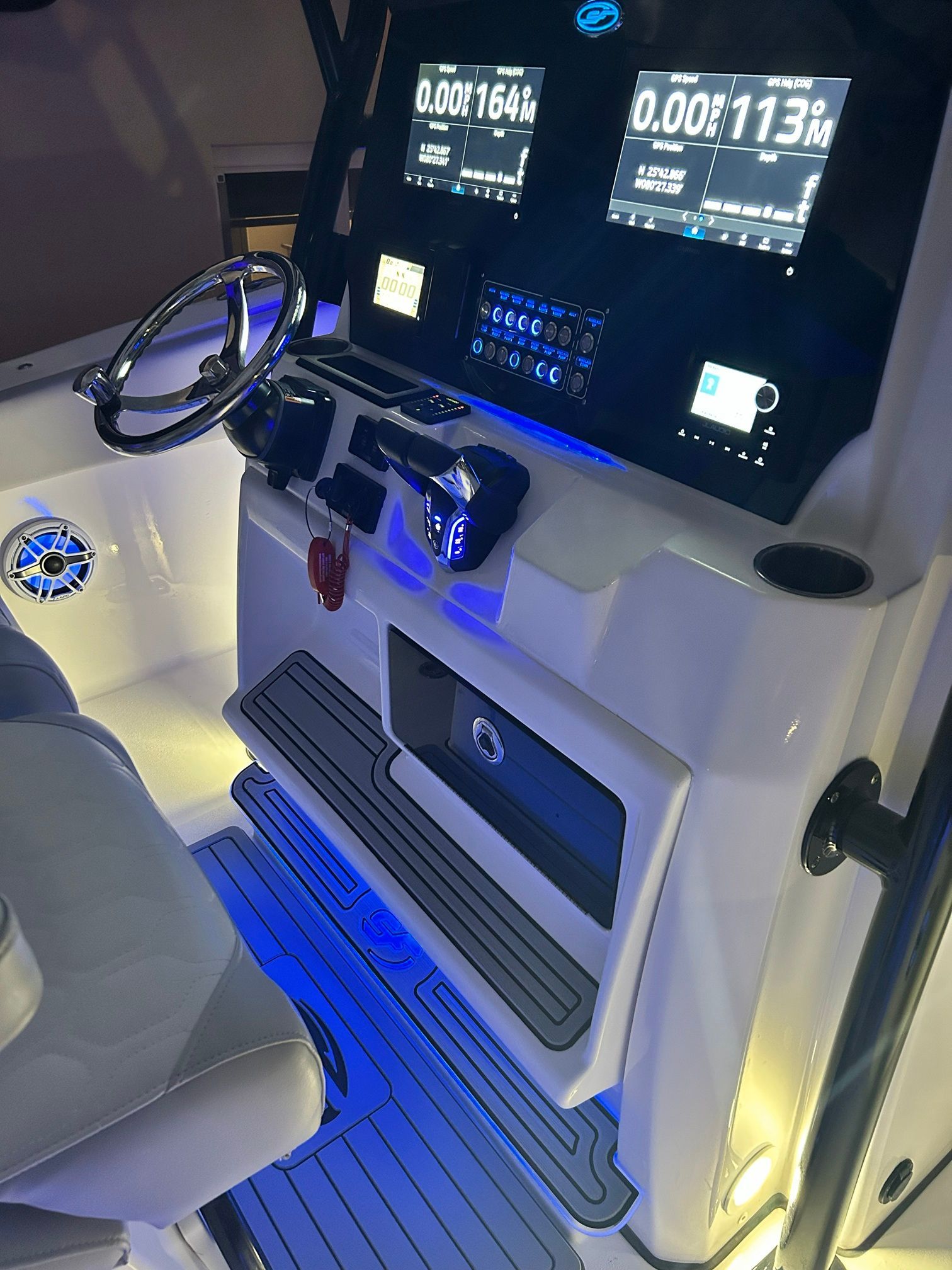 The Sea Fox 288 Commander cockpit features modern instruments and blue LED lighting.