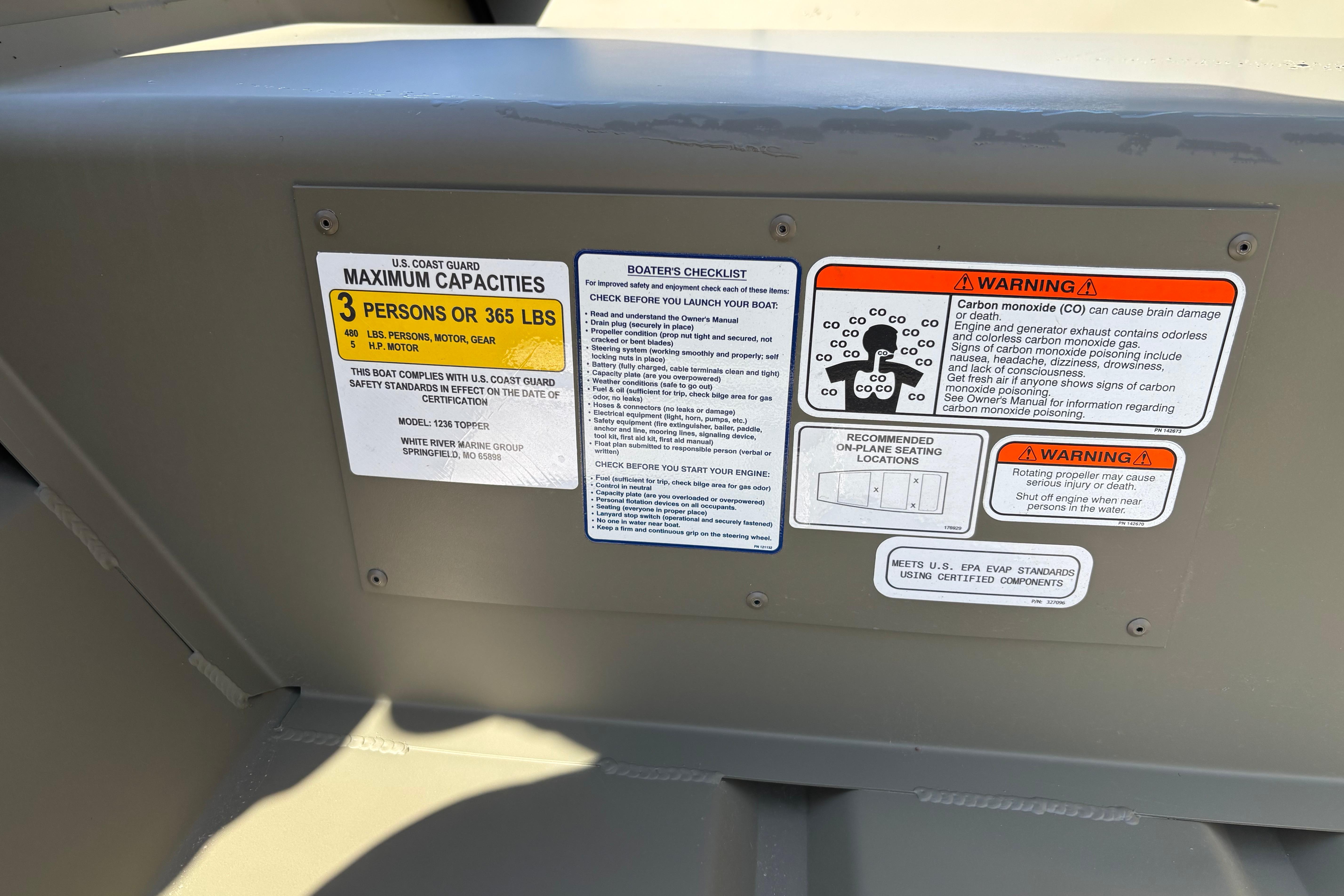 Safety and capacity labels on 2026 Tracker Grizzly 12 Jon boat interior.