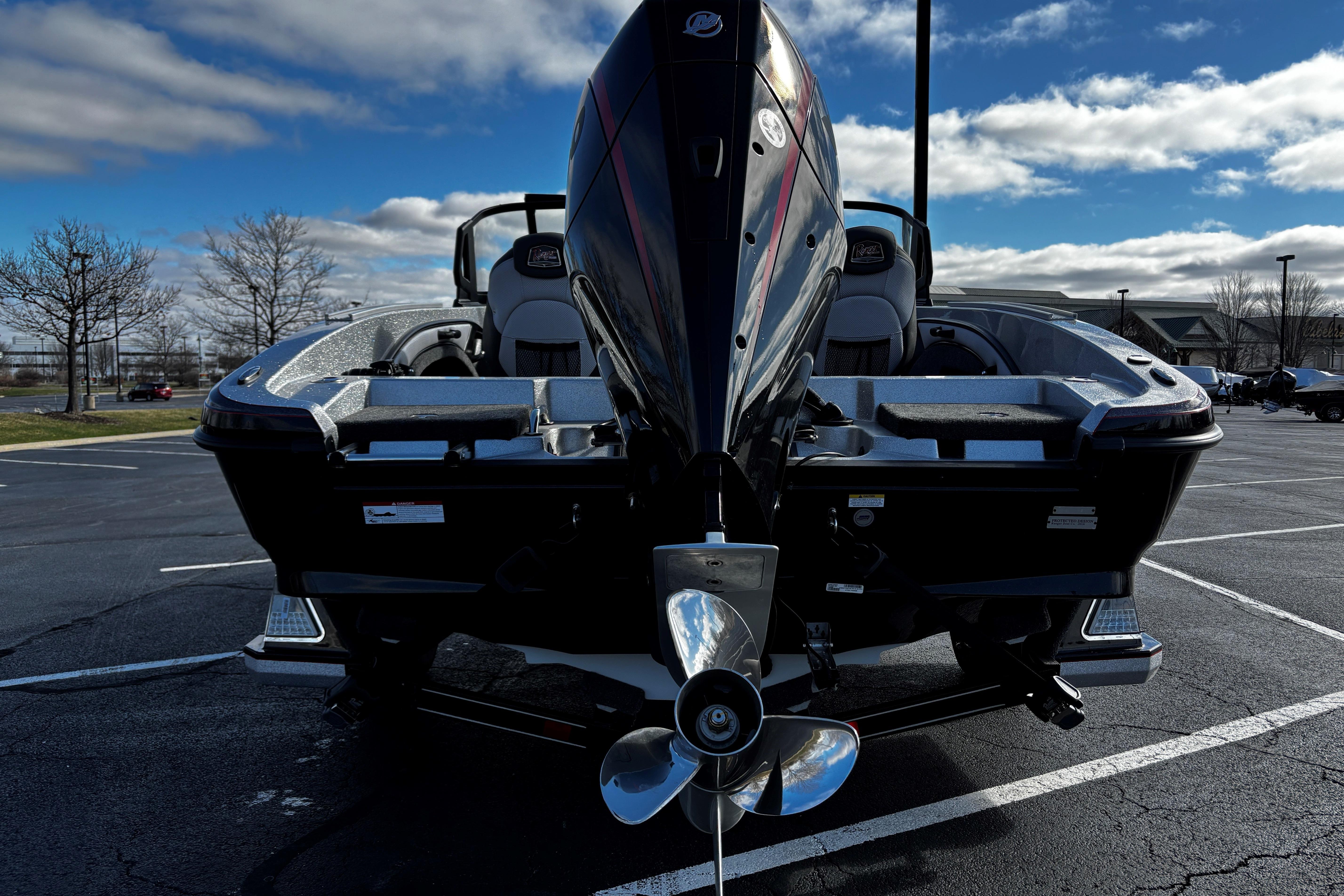 2026 Ranger 1880MS boat with powerful outboard motor in a parking lot.