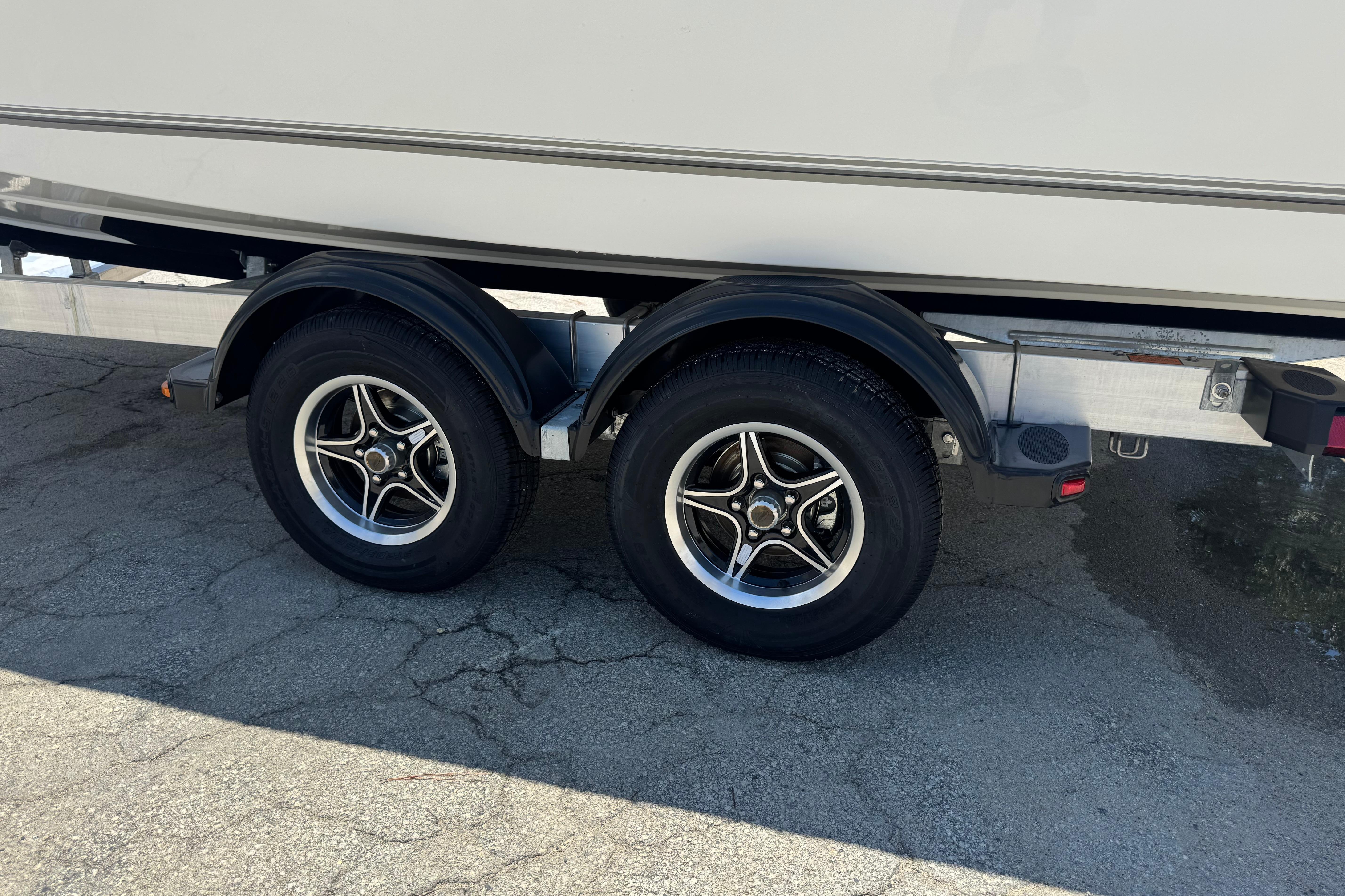 Trailer with dual wheels for 2026 Mako 214 Center Console boat.