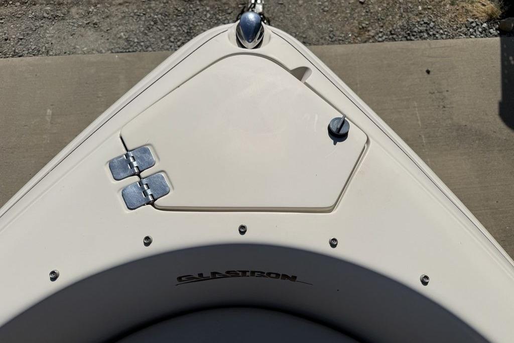 Bow of a 1999 Glastron GT 225 boat with hatch and hinges.