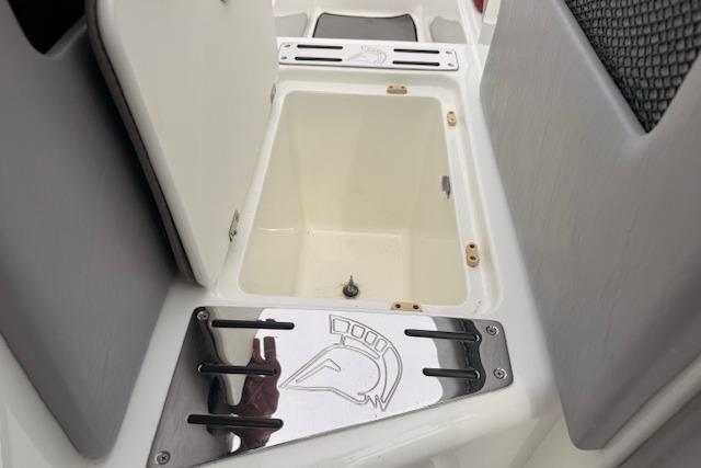 Open storage compartment on 2013 Centurion Enzo SV244 boat interior.