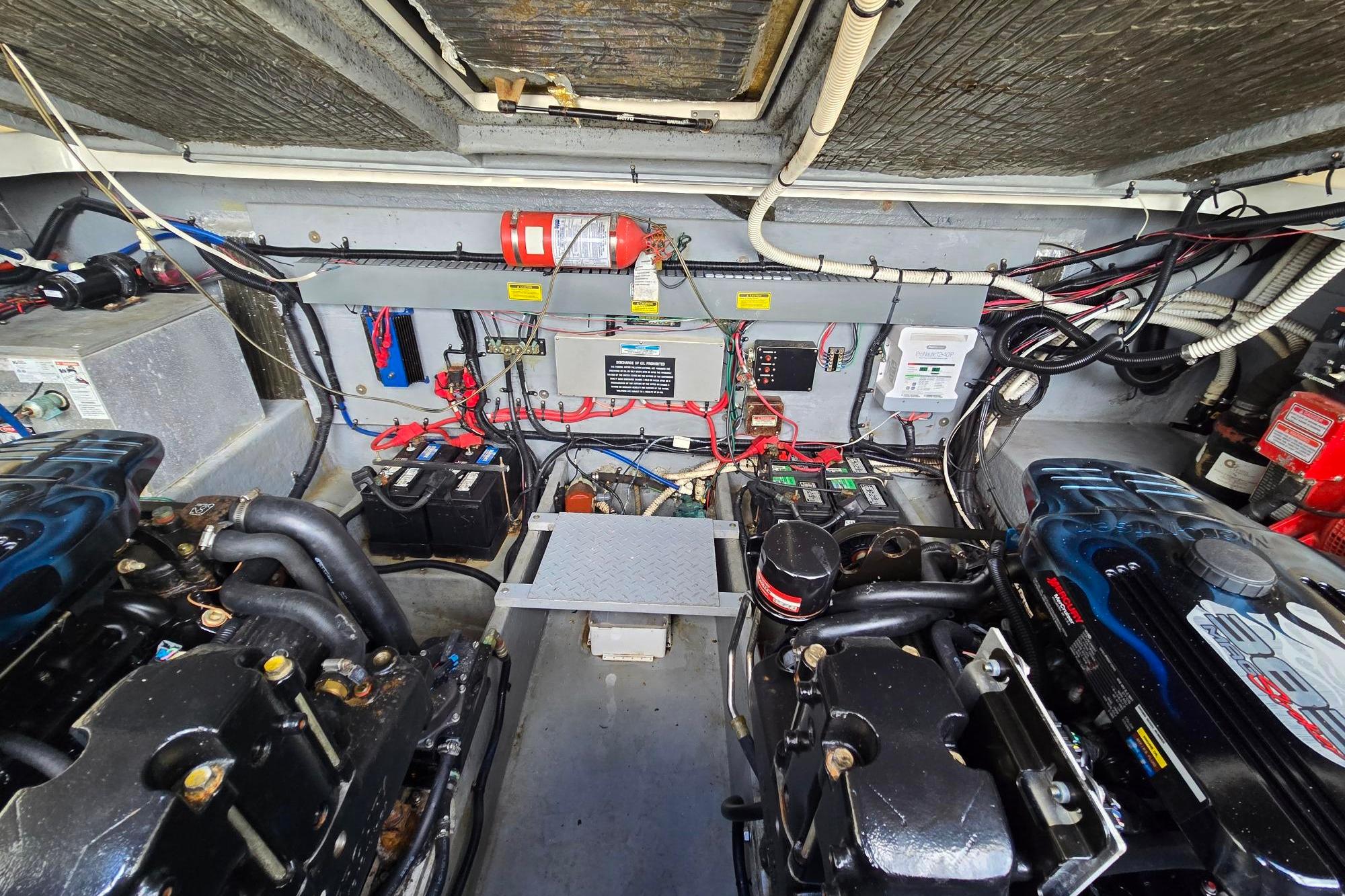 Engine room of a 1998 Sea Ray 330 Express, showcasing dual Stroker 383 with under 20 hours on them