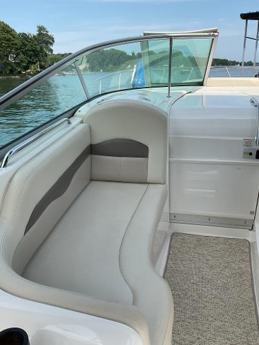 Interior of a 2008 Chaparral Signature 310 boat with beige seating area.