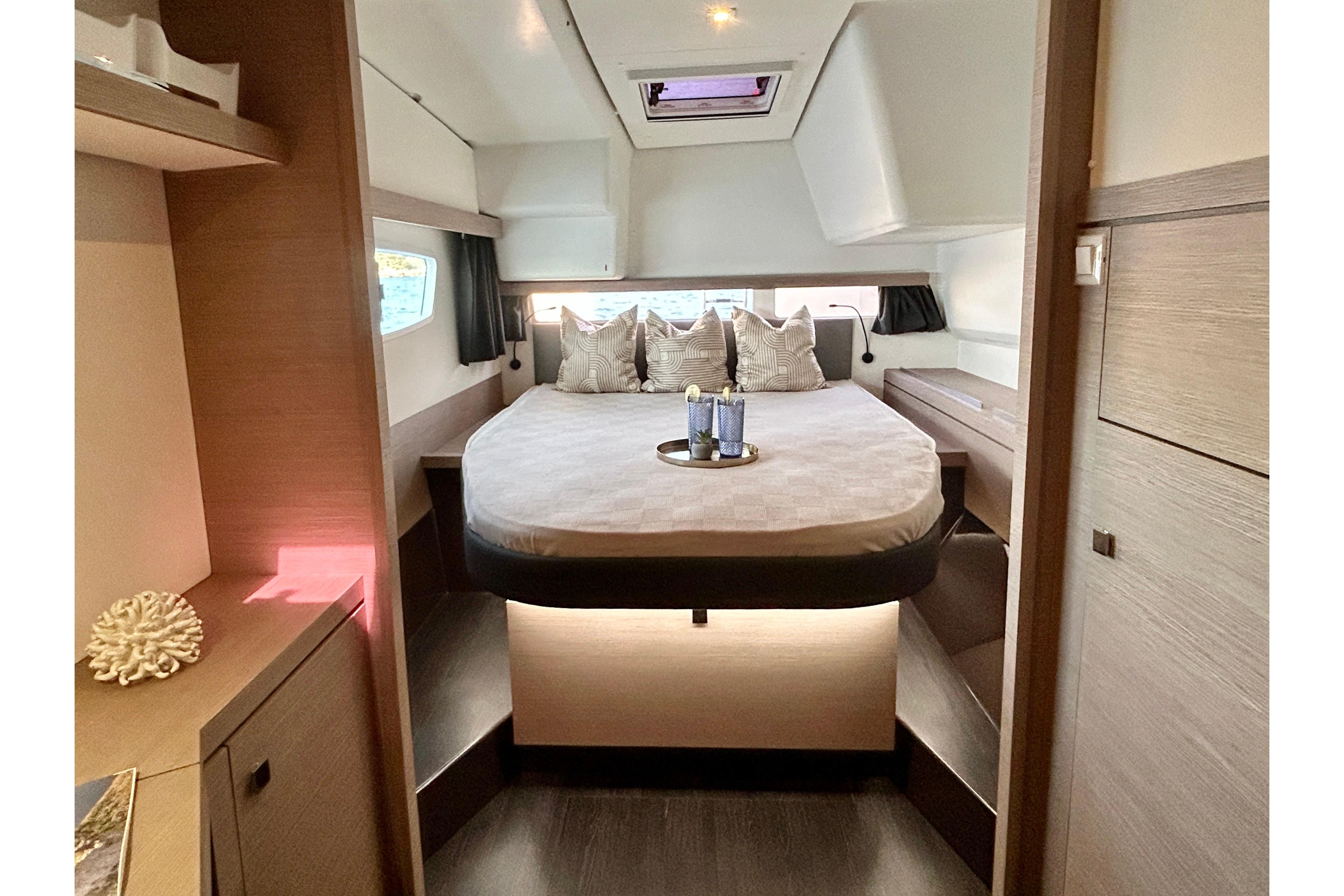 Luxurious bedroom interior of 2021 Fountaine Pajot Isla 40 catamaran with modern design.